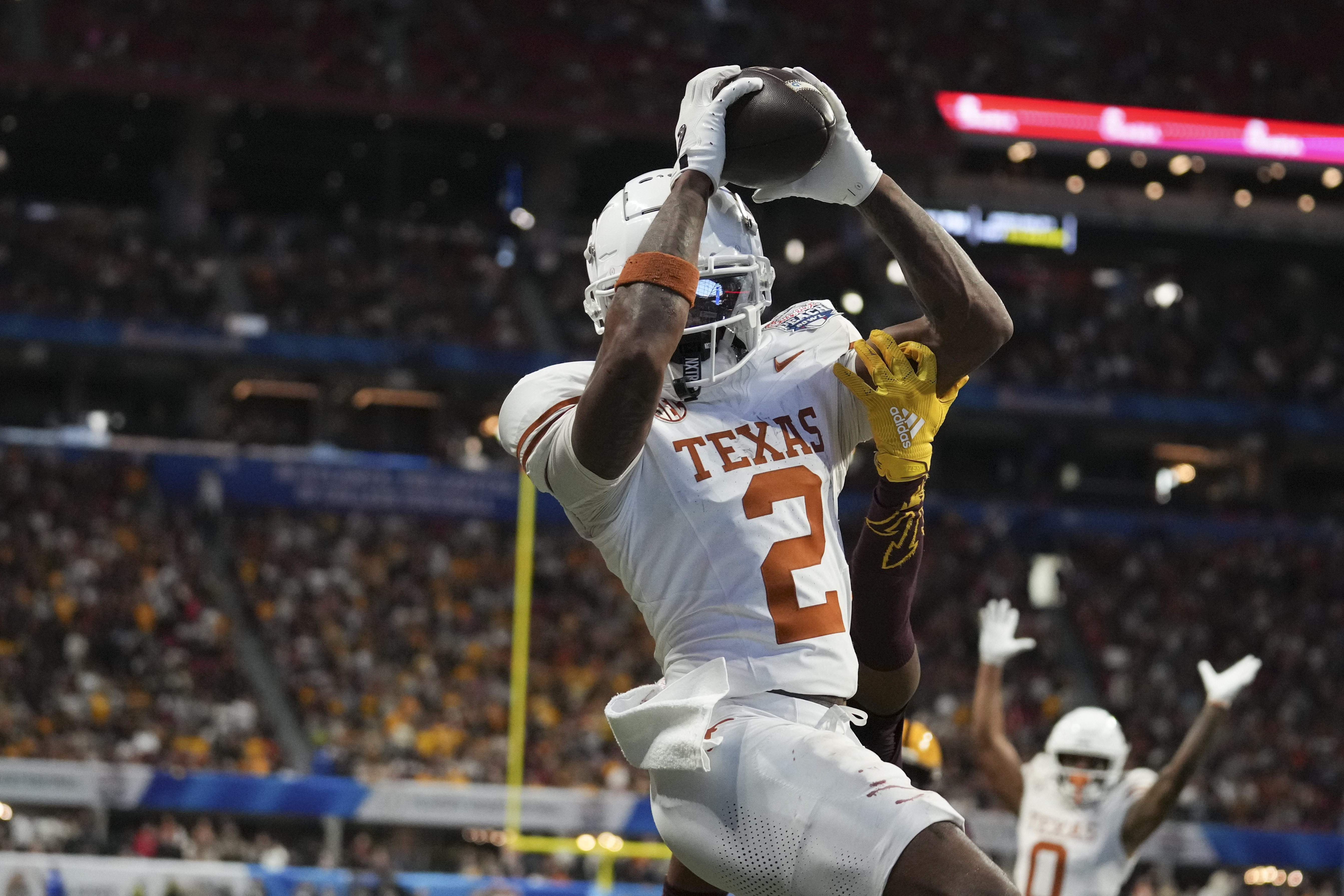 Texas wide receiver Matthew Golden (2) catches a two-point conversion against Arizona State during overtime in the quarterfinals of a College Football Playoff game, Wednesday, Jan. 1, 2025, in Atlanta. Texas won 39-31 in two overtime periods. (AP Photo/Brynn Anderson) (Brynn Anderson)