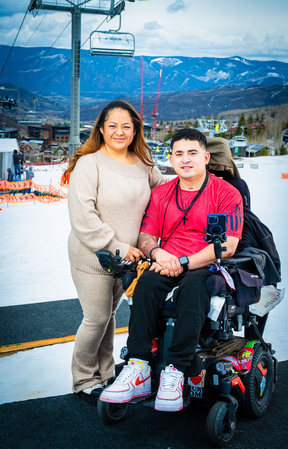 Navy veteran JJ Trammell and his caregiver, mother Maria Trammell, pose for a photo during the annual National Disabled Veterans Winter Sports Clinic in Snowmass earlier this month. (Axel Villacis-Maldonado, U.S. Department of Veterans Affairs)