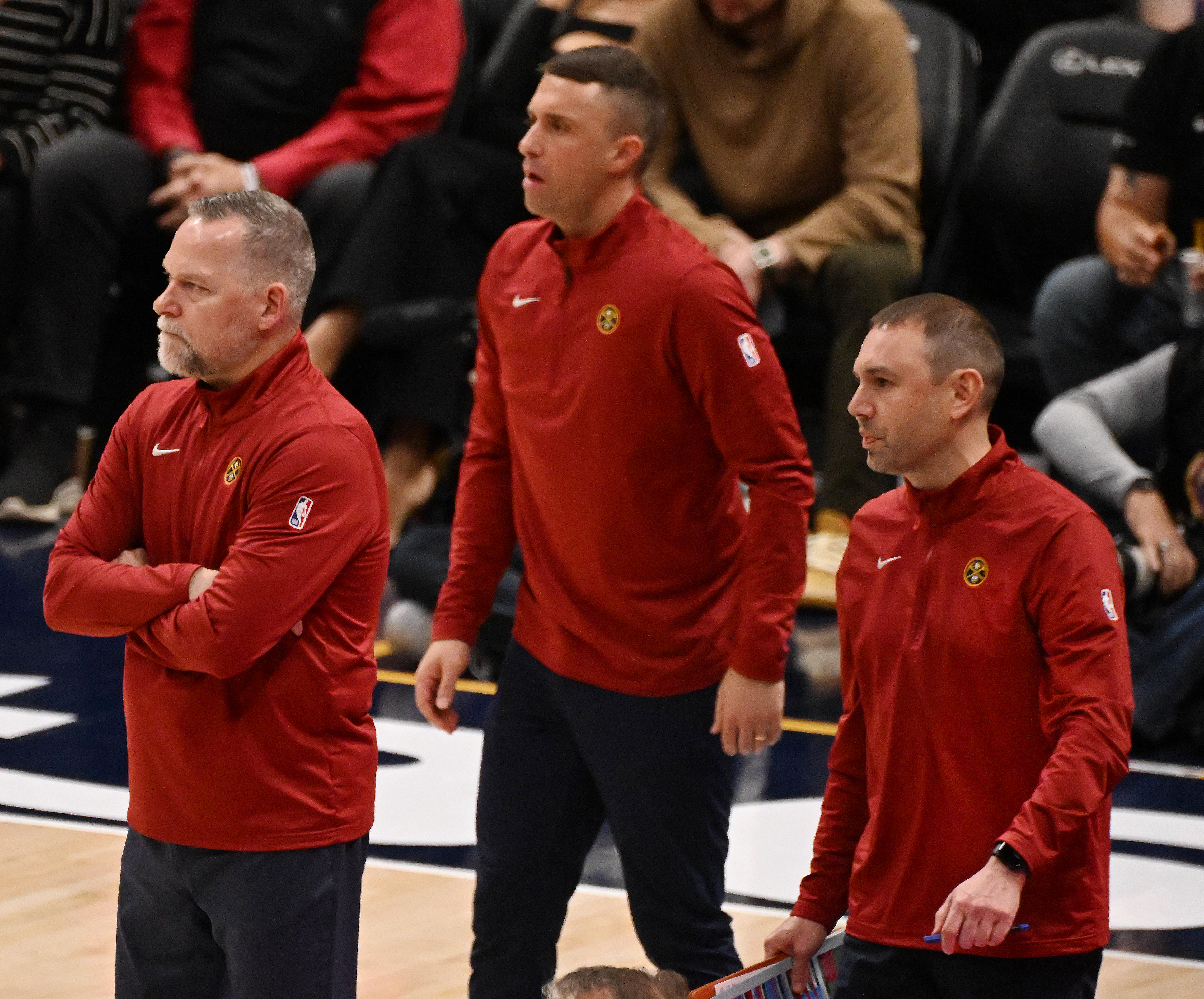 Nuggets Head Coach Michael Malone and Asst. Coaches Ryan Saunders David Adelman watch from the sidelines during the 4th quarter of a game against the Spurs on Wednesday, April 2, 2025.