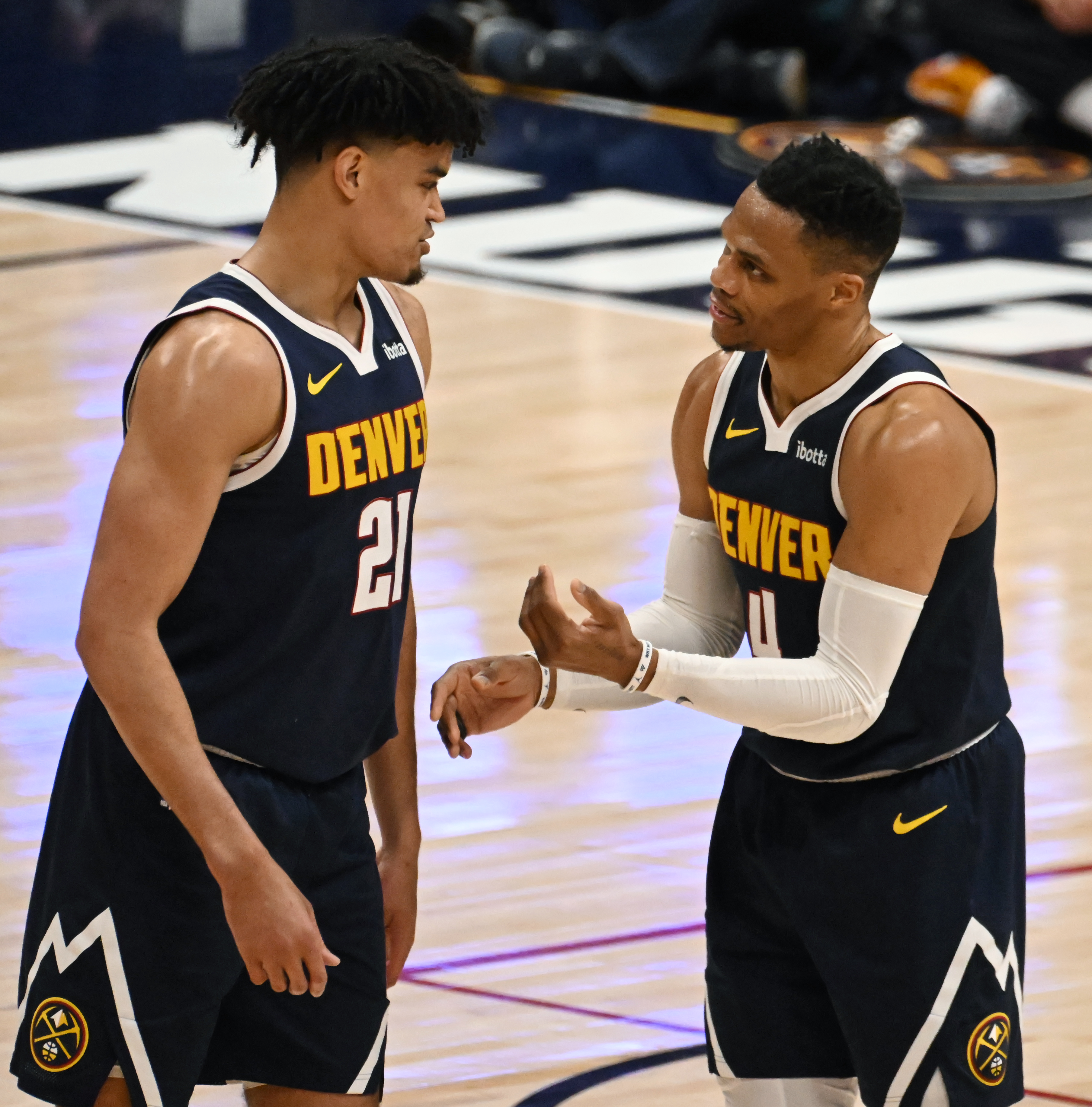 Veteran player Denver Nuggets guard Russell Westbrook (4) gives some tips to youngster Denver Nuggets forward Spencer Jones (21) during a game against the Spurs at Ball Arena on Thursday, April 3, 2025. (Jerilee Bennett,The Gazette)