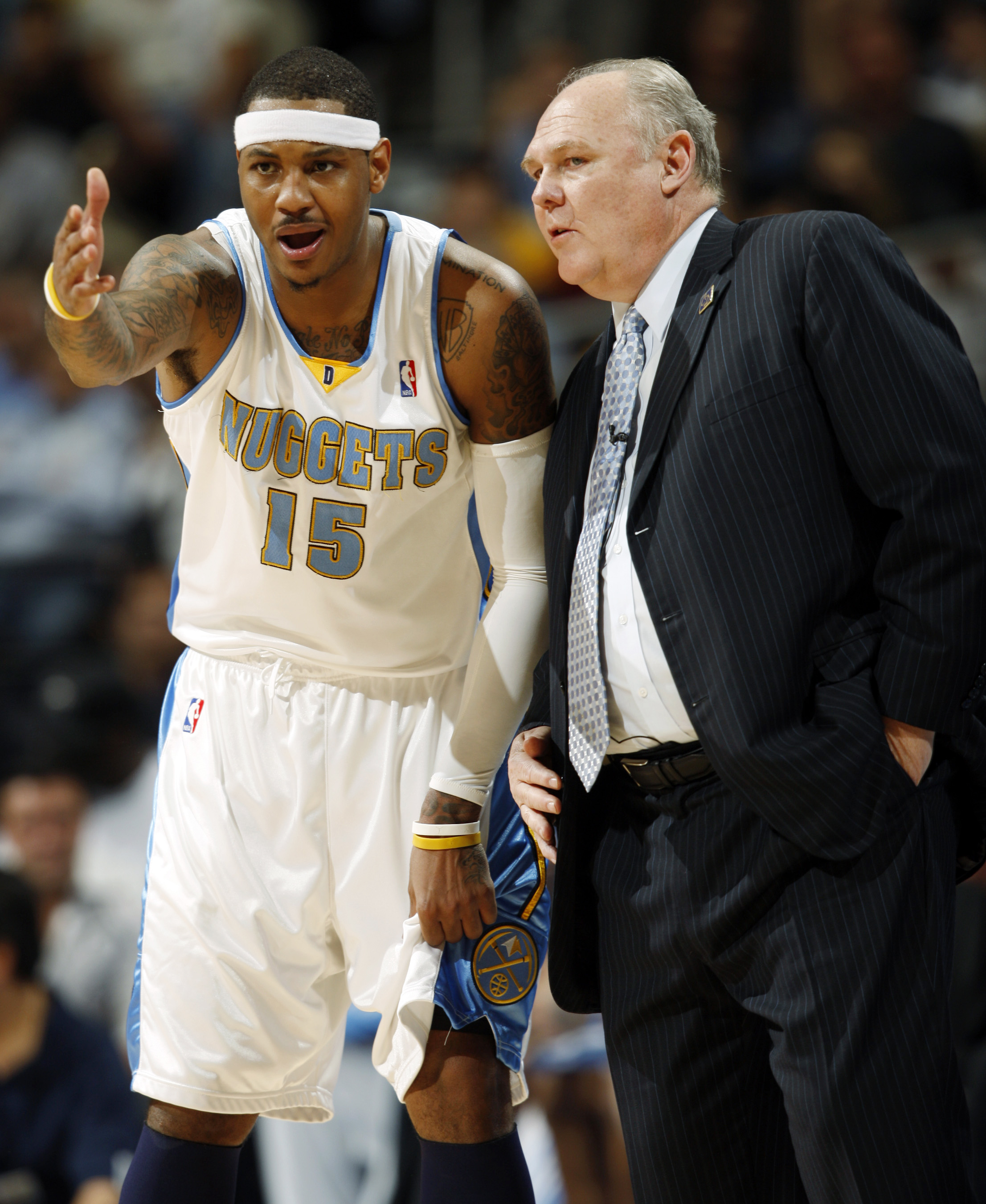 Denver Nuggets forward Carmelo Anthony, left, confers with head coach George Karl as the Nuggets face the Dallas Mavericks in the third quarter of the Nuggets' 117-105 victory in Game 2 of an NBA Western Conference semifinal in Denver on Tuesday, May 5, 2009. The Nuggets won the first two games of the series, which heads to Dallas for a showdown on Saturday. (AP Photo/Jack Dempsey) (Jack Dempsey)