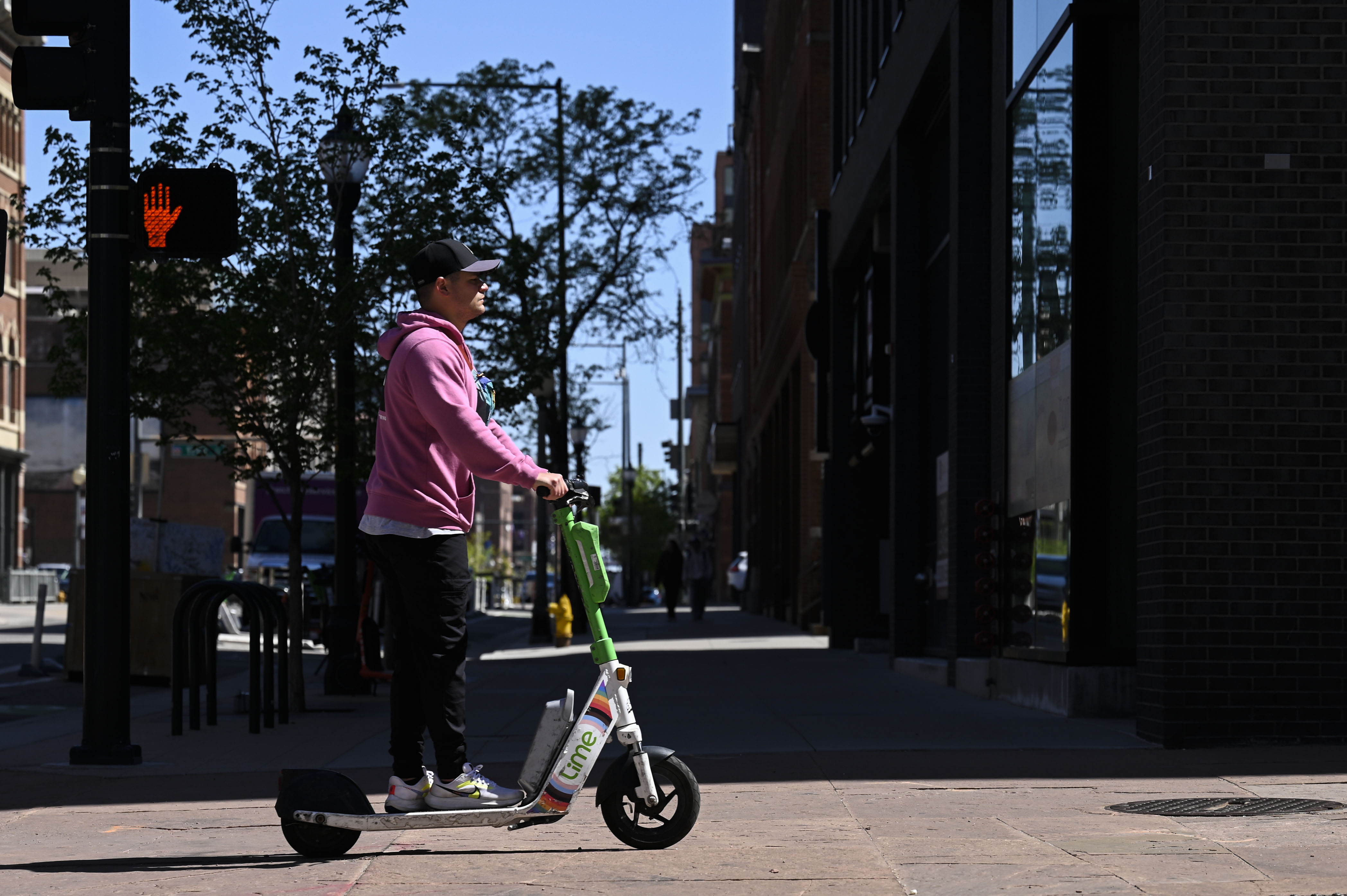 People ride rental scooters through downtown Denver on Tuesday, April 29, 2025. (Stephen Swofford, Denver Gazette) (StephenSwoffordPhotographerstephen.swofford@gazette.comhttps://secure.gravatar.com/avatar/1ddcaf11c5d70eaa58546ddc4e038687?d=mm&r=g)