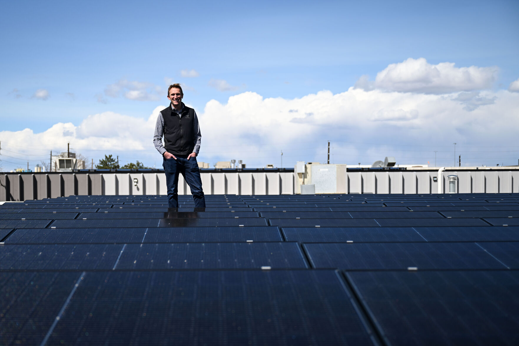 David Spriggs stands with a row of solar panels on the roof of one of his buildings in Denver on Wednesday, April 2, 2025. He expects to spend $20,000 to $30,000 for a study following standards of the American Society of Heating, Refrigerating and Air Conditioning Engineers to create a customized compliance plan - all before making any actual improvements in the building. (StephenSwoffordPhotographerstephen.swofford@gazette.comhttps://secure.gravatar.com/avatar/1ddcaf11c5d70eaa58546ddc4e038687?d=mm&r=g)