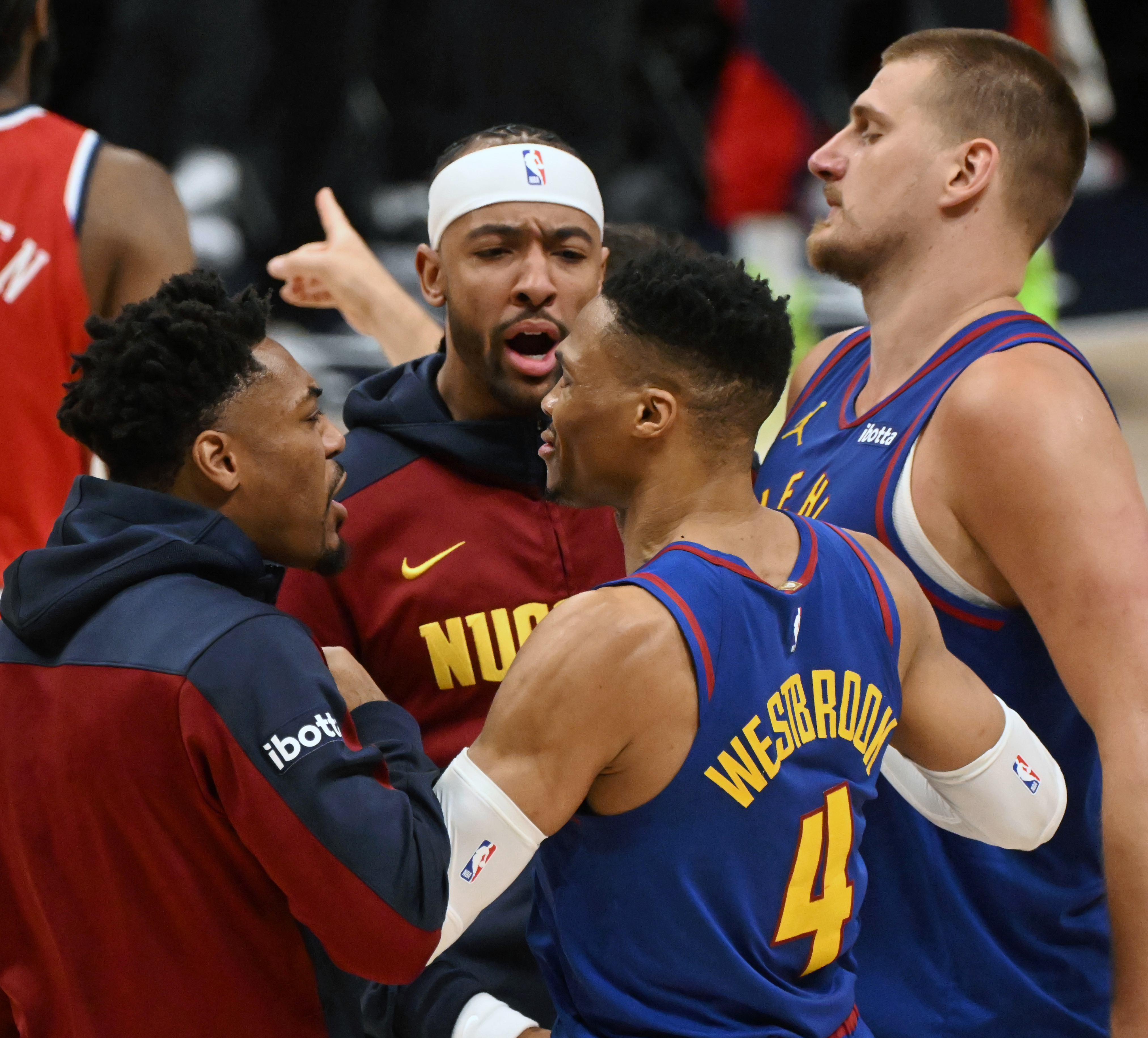 Nuggets Russell Westbrook celebrates with teammates Jalen Pickett, Zeke Nnai and Nikola Jokic after sinking a three-pointer that helped send them to overtime in the 4th quarter of the first series of the NBA playoffs at Ball Arena on Saturday, April 19, 2025. The Nuggets won the game in overtime 112-110. (Jerilee Bennett, The Gazette)