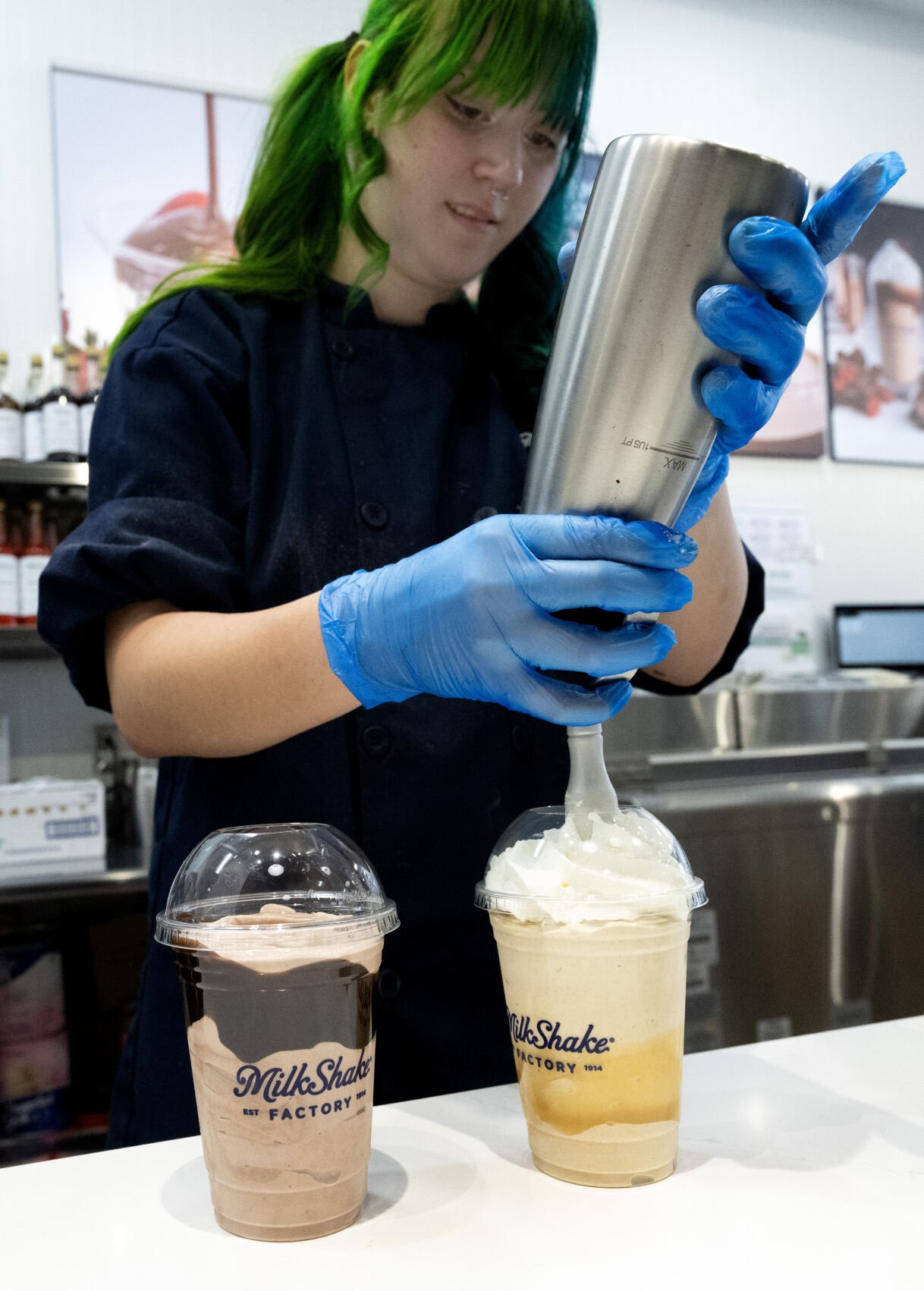Natalie Mahaffey adds the final touches to a pair of milkshakes Tuesday, April 22, 2025, at the MilkShake Factory in the Briargate area of Colorado Springs. (Christian Murdock, The Gazette)
