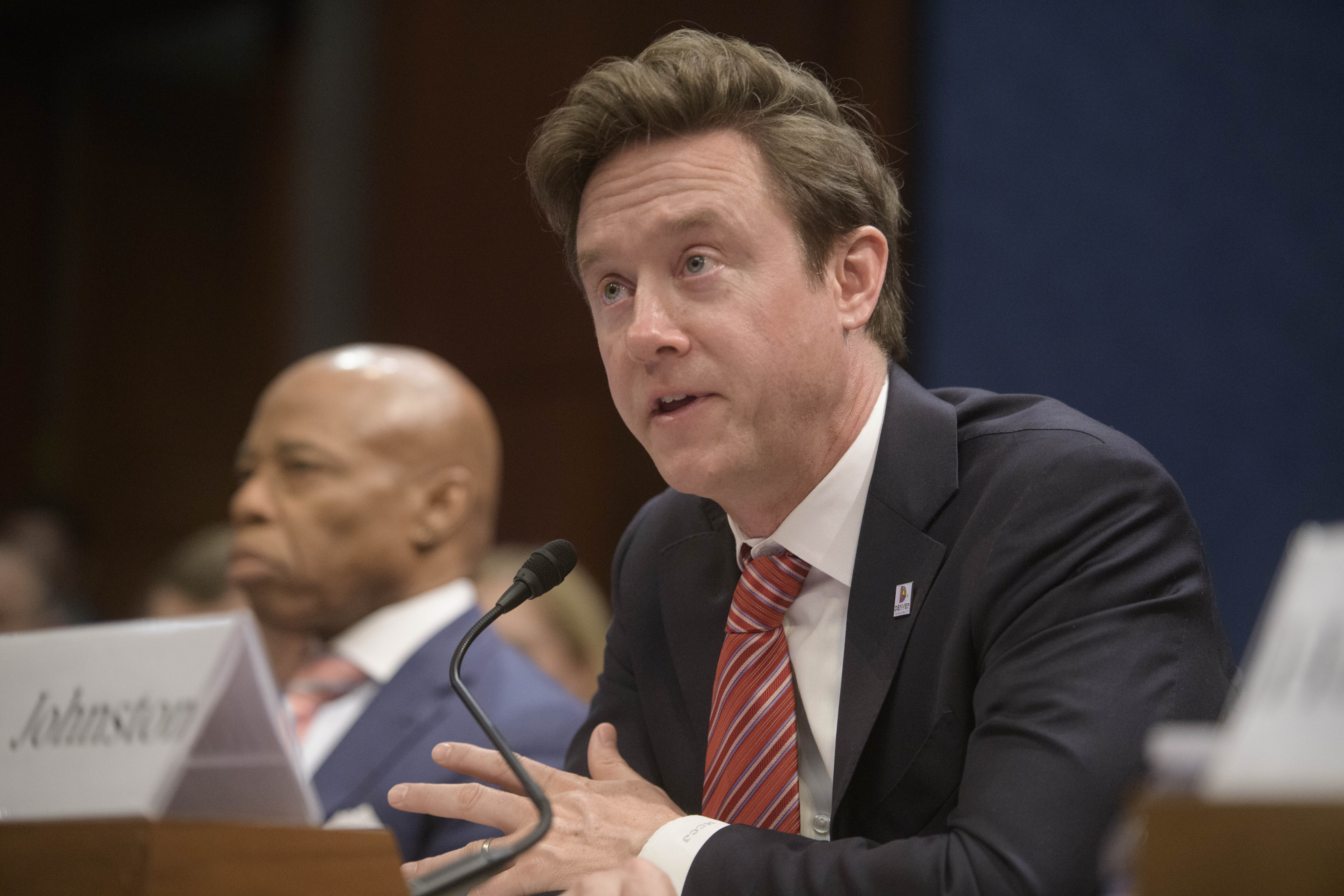 Denver Mayor Mike Johnston responds to questions during a House Committee on Oversight and Government Reform hearing with 