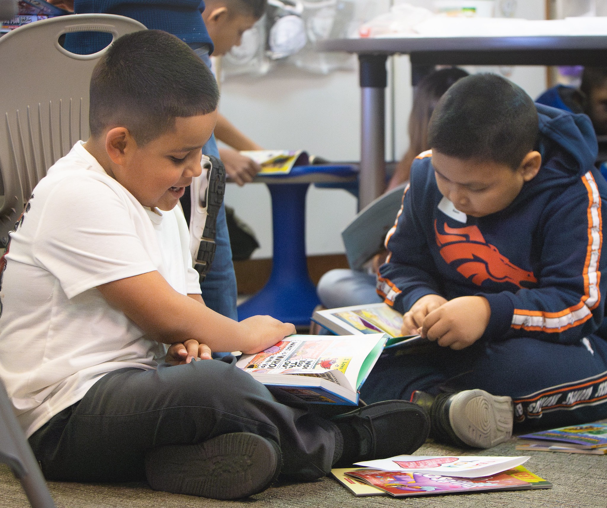 Book Trust students enjoy their new books. (Courtesy photo, Stone's Throw Productions)