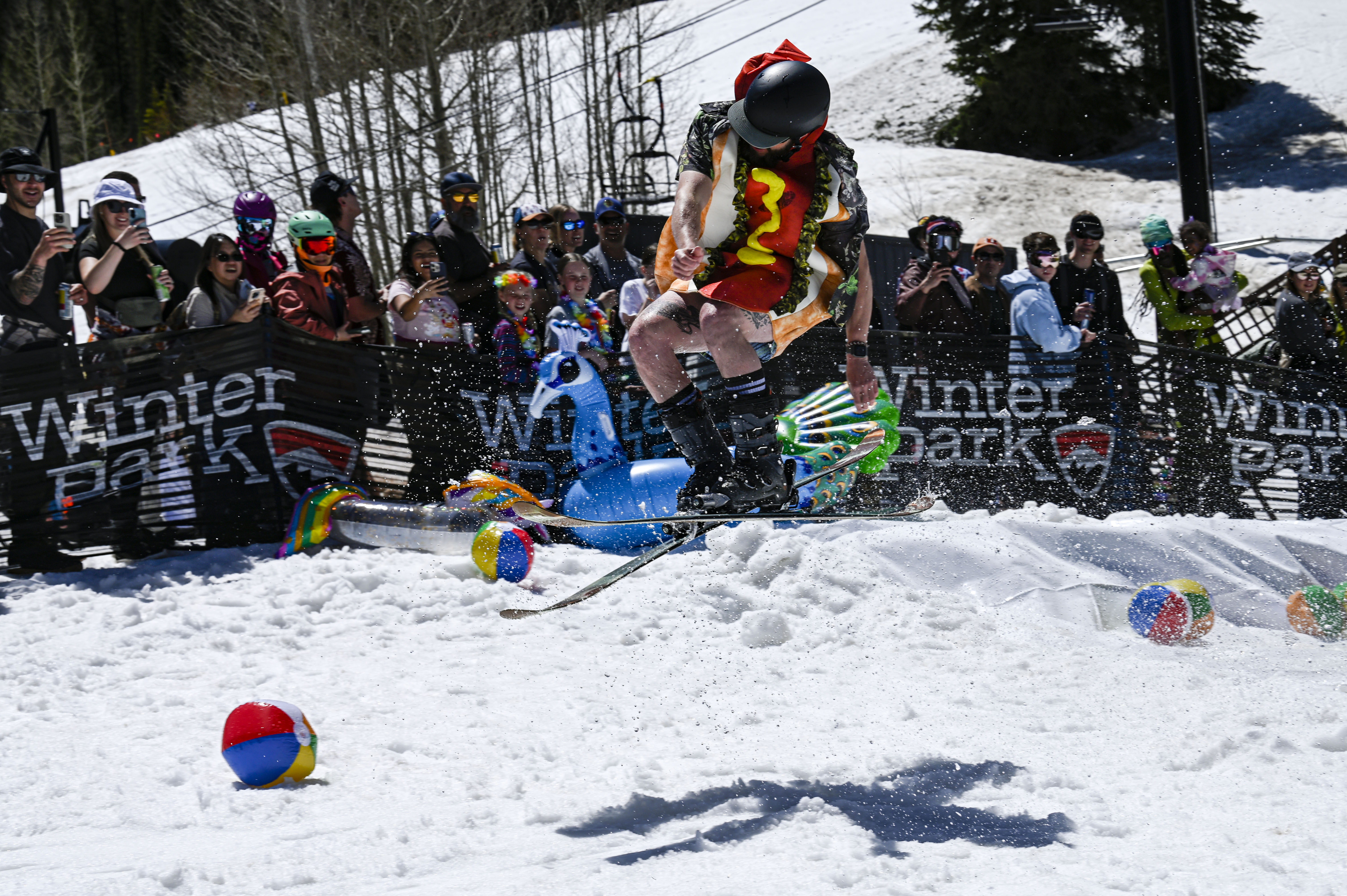 A skier jumps after crossing a pool of water at the base of Winter Park during the Spring Splash event to celebrate the last day of the season on Sunday, April 27, 2025 (Stephen Swofford, Denver Gazette) (StephenSwoffordPhotographerstephen.swofford@gazette.comhttps://secure.gravatar.com/avatar/1ddcaf11c5d70eaa58546ddc4e038687?d=mm&r=g)