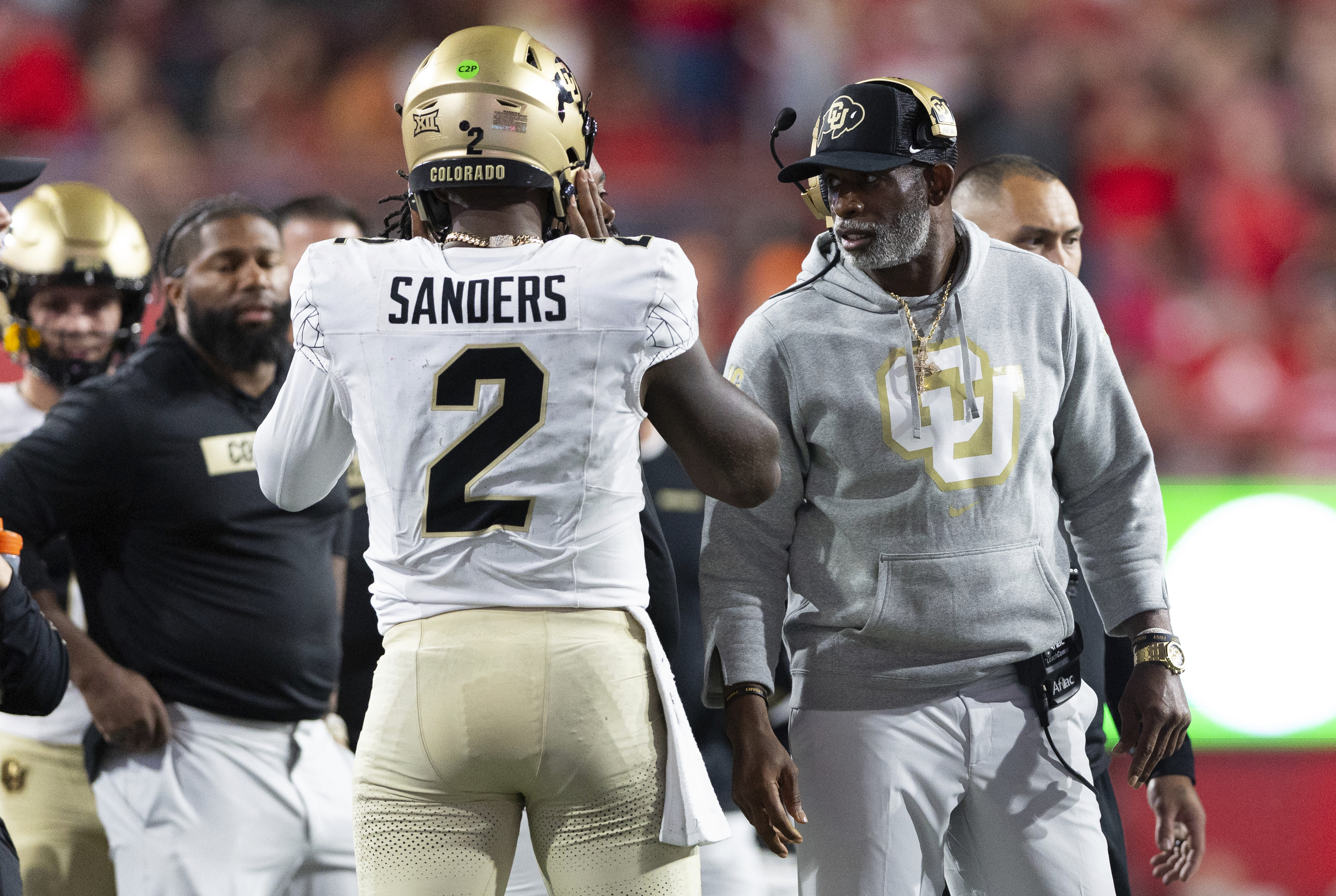 Colorado head coach Deion Sanders, right, talks with quarterback Shedeur Sanders on the sideline between plays against Nebraska during the second half of a game on Sept. 7 in Lincoln, Neb. (The Associated Press)