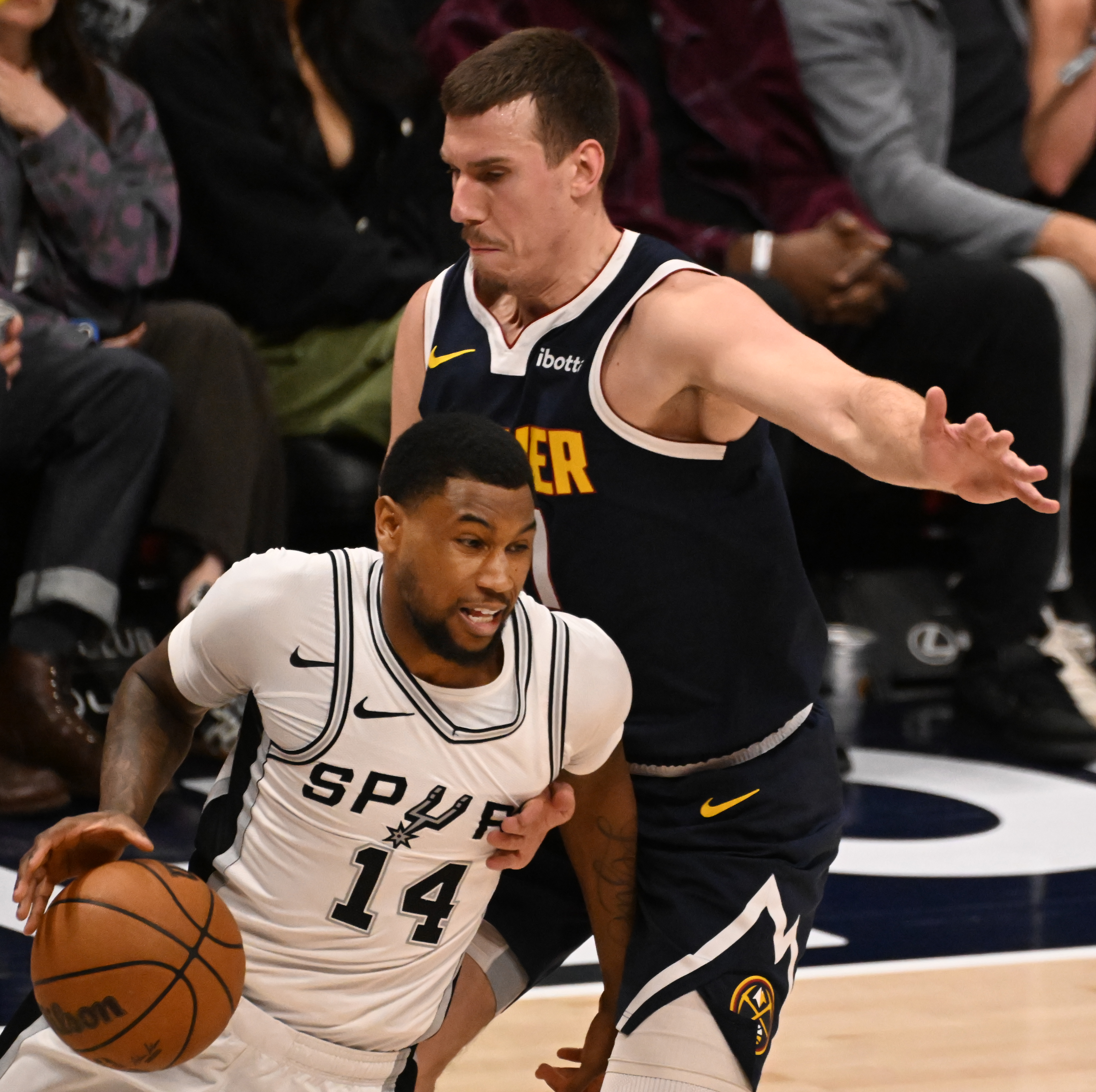 Spurs Blake Wesley is defended by Nuggets Vlatko Čančar in the 4th quarter during a game at Ball Arena on Wednesday, April 2, 2025. (Jerilee Bennett,The Gazette)