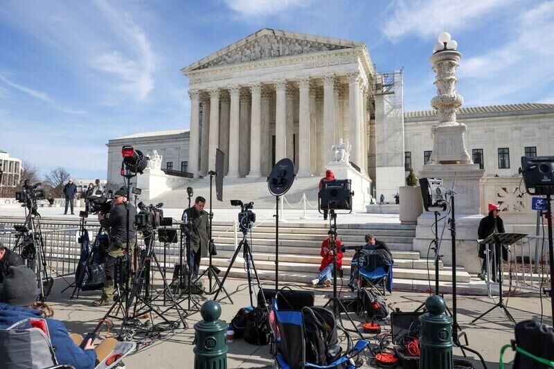 Members of the media set up their work area outside the U.S. Supreme Court as justices hear arguments in former U.S. President Donald Trump's appeal of a lower court's ruling disqualifying him from the Colorado presidential primary ballot, in Washington, U.S., February 8, 2024. REUTERS/Amanda Andrade-Rhoades/File Photo
