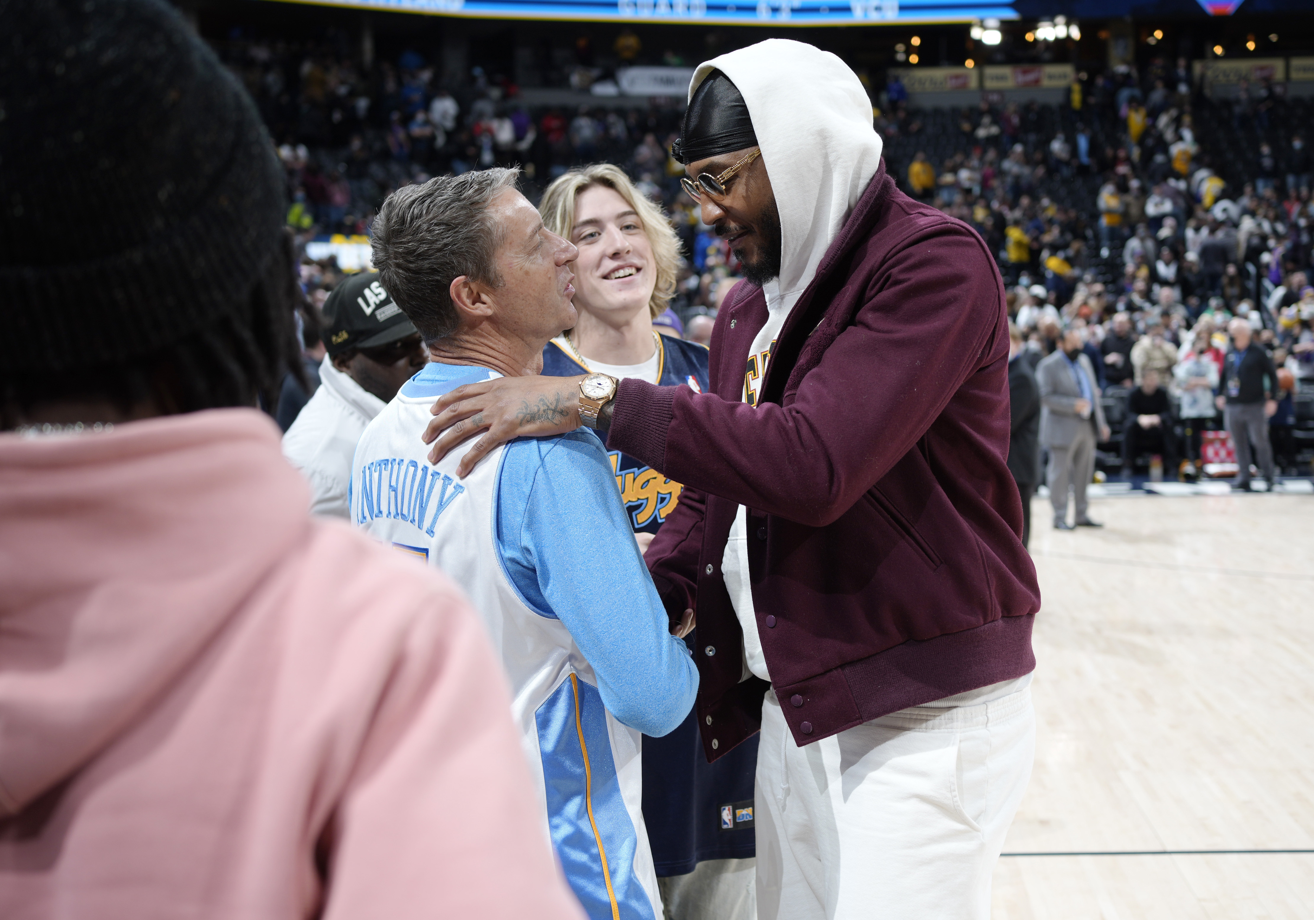 Los Angeles Lakers forward Carmelo Anthony, right, greets fans after the second half of an NBA basketball game against the Denver Nuggets Saturday Jan. 15, 2022, in Denver. The Nuggets won 133-96. (AP Photo/David Zalubowski) (David Zalubowski)