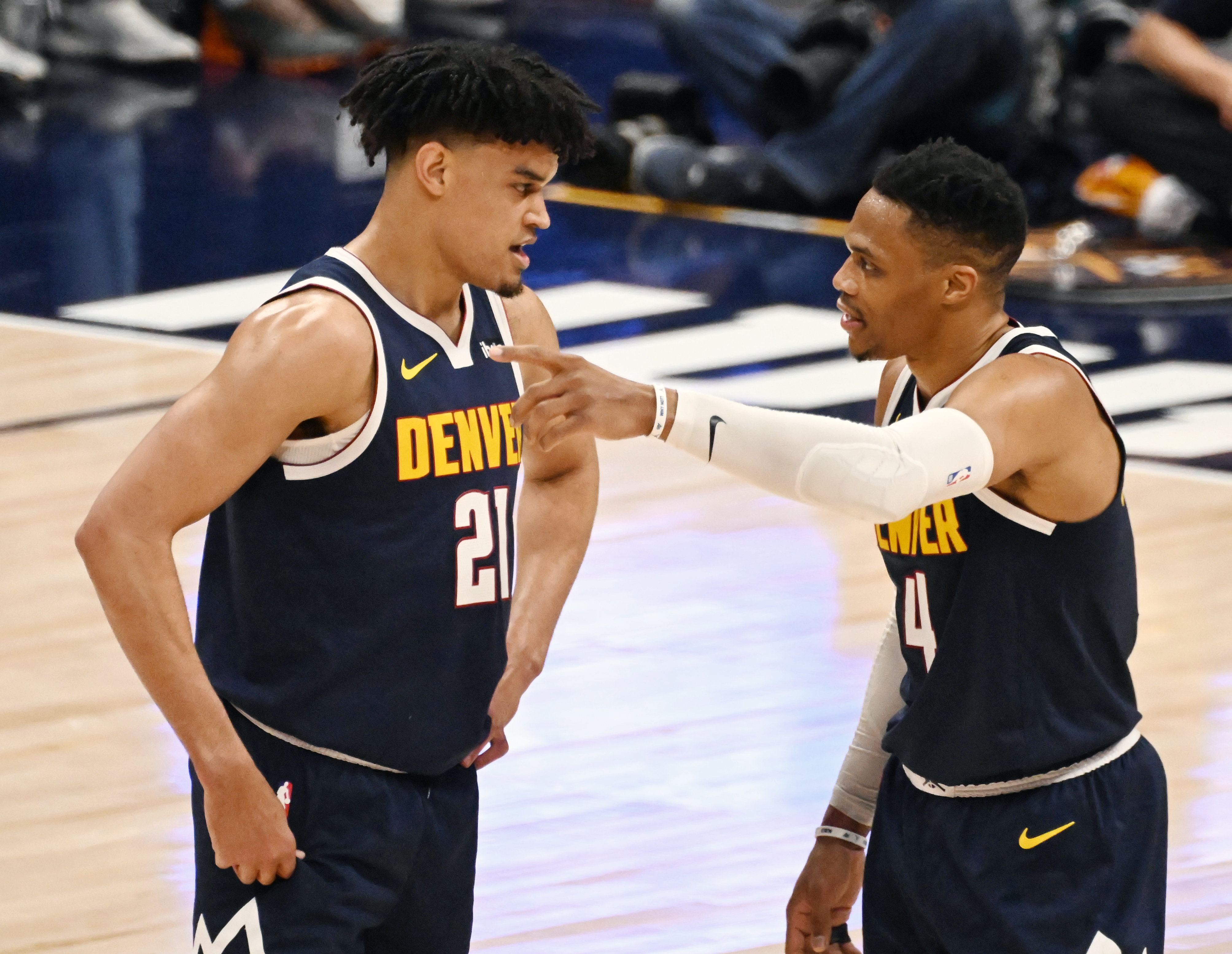 Veteran player Denver Nuggets guard Russell Westbrook (4) gives some tips to youngster Denver Nuggets forward Spencer Jones (21) during a game against the Spurs at Ball Arena on Thursday, April 3, 2025. (Jerilee Bennett, The Gazette)