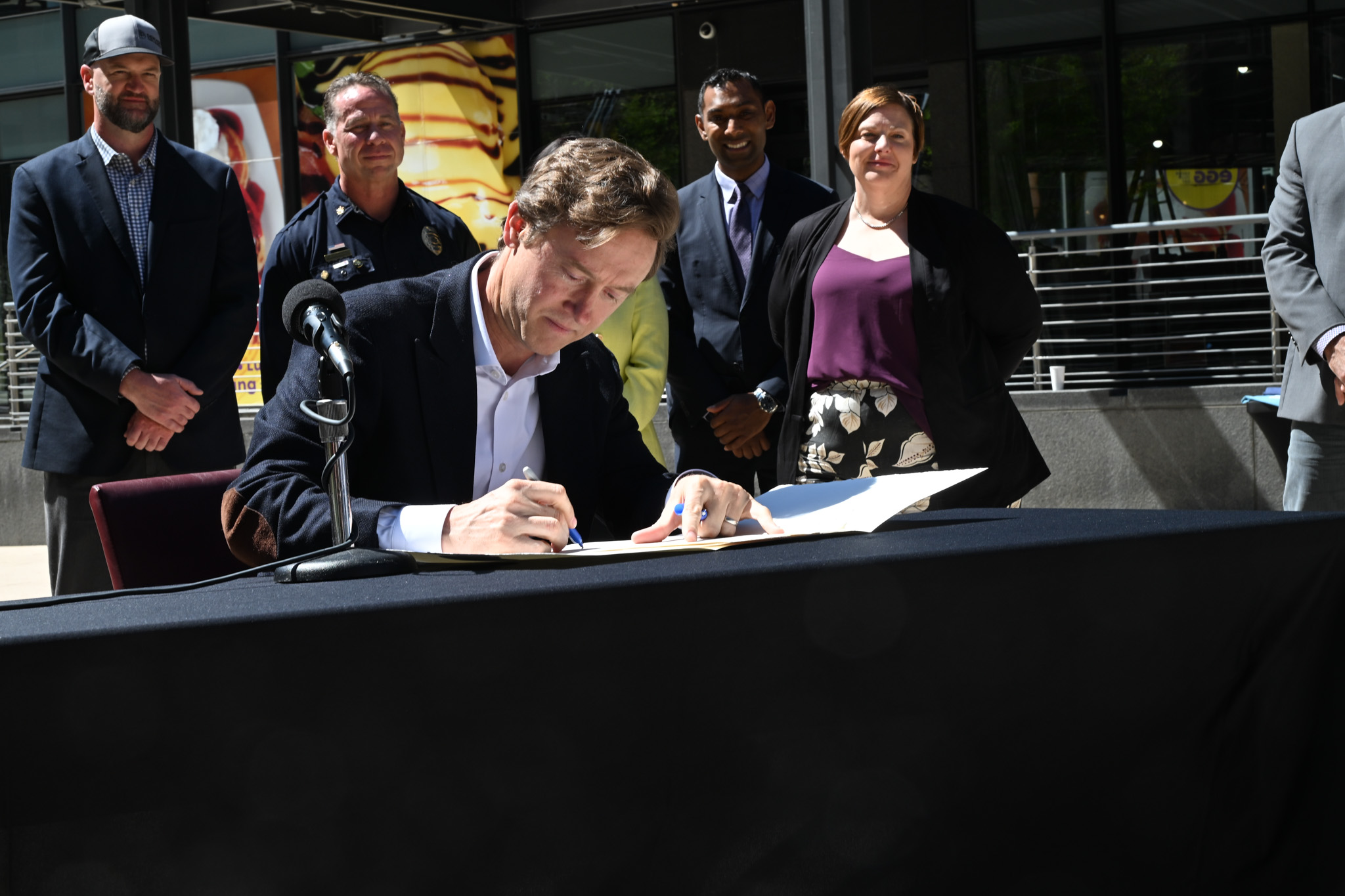 Denver Mayor Mike Johnston signs the first executive order of his administration on April 14, creating the Denver Permitting Office or DPO. The new office promises to streamline the permitting process and will hold the city accountable to deliver faster and more efficient service to those looking to build housing or open businesses in the city. (Deborah Grigsby/The Denver Gazette) (Deborah Grigsby)
