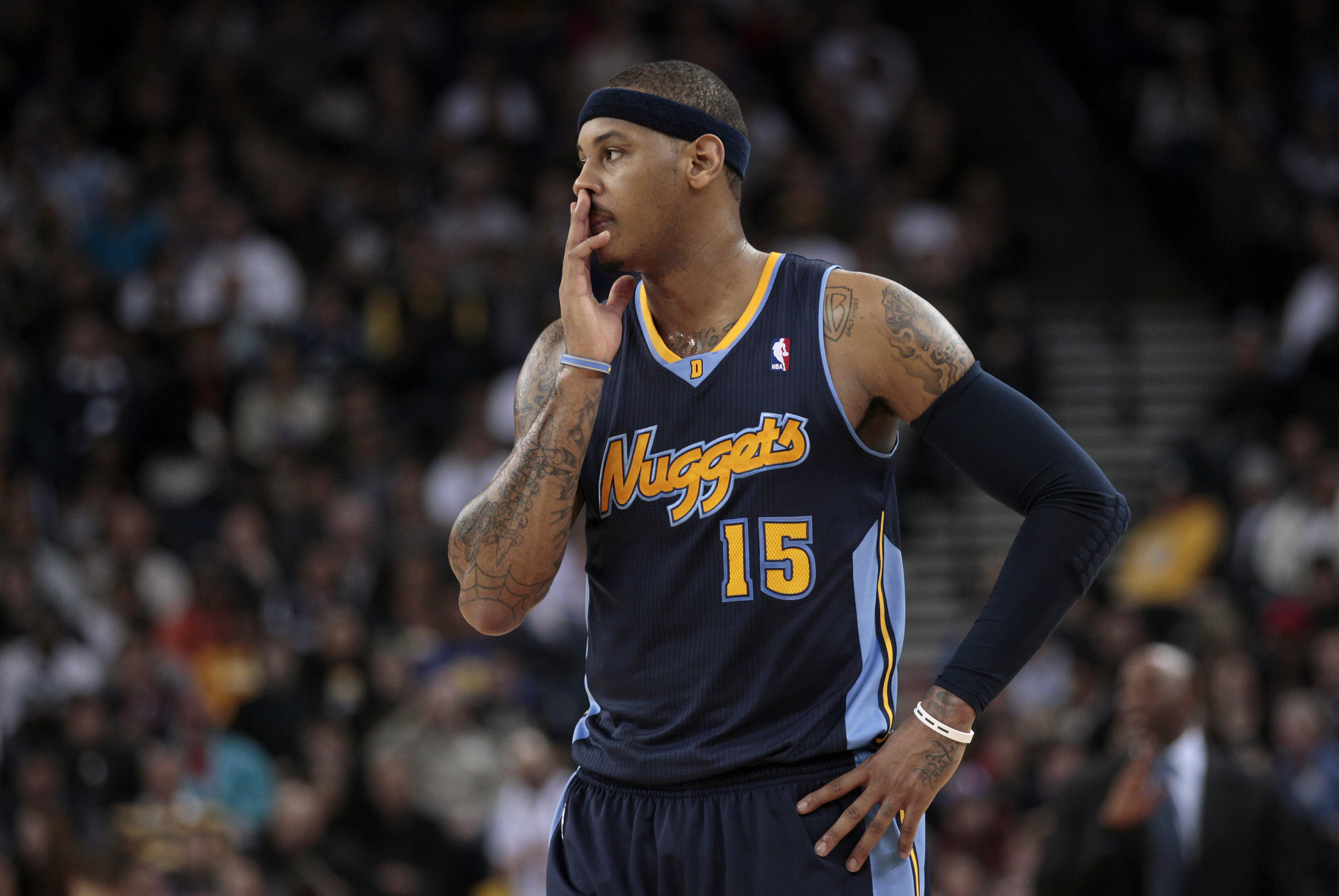 Denver Nuggets small forward Carmelo Anthony (15) stands on the court in the third quarter of an NBA basketball game against the Golden State Warriors in Oakland, Calif., Wednesday, Feb. 9, 2011. The Warriors won 116-114. (AP Photo) (Anonymous)