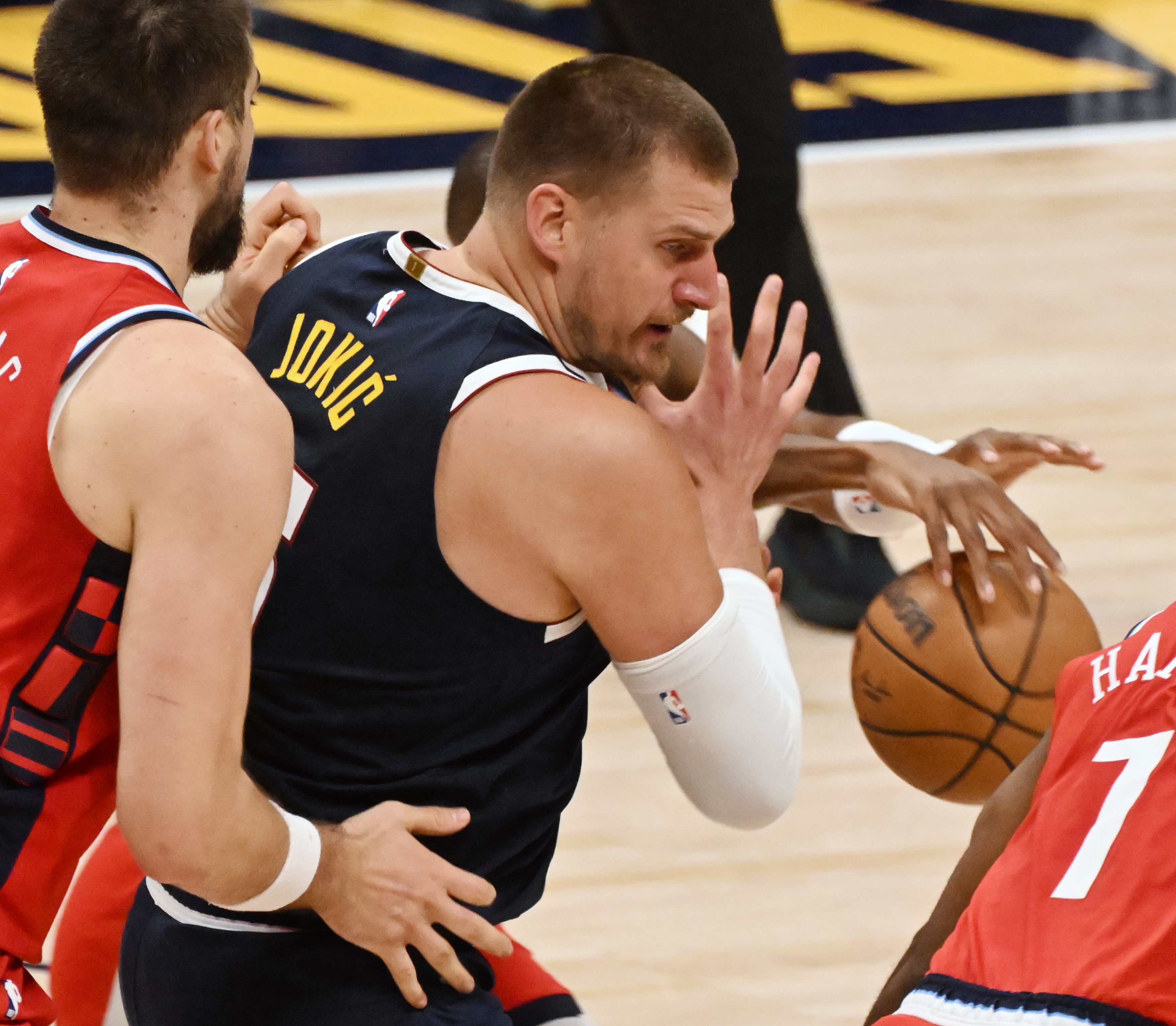 Denver Nuggets center Nikola Jokic (15) gets pressured by LA Clippers center Ivica Zubac (40) and has the ball knocked out of his hands by LA Clippers guard Kris Dunn (8) during the 2nd quarter of game 2 of Round 1 of the NBA Western Championship at Ball Arena on Monday, April 21, 2025. (Jerilee Bennett,The Gazette)