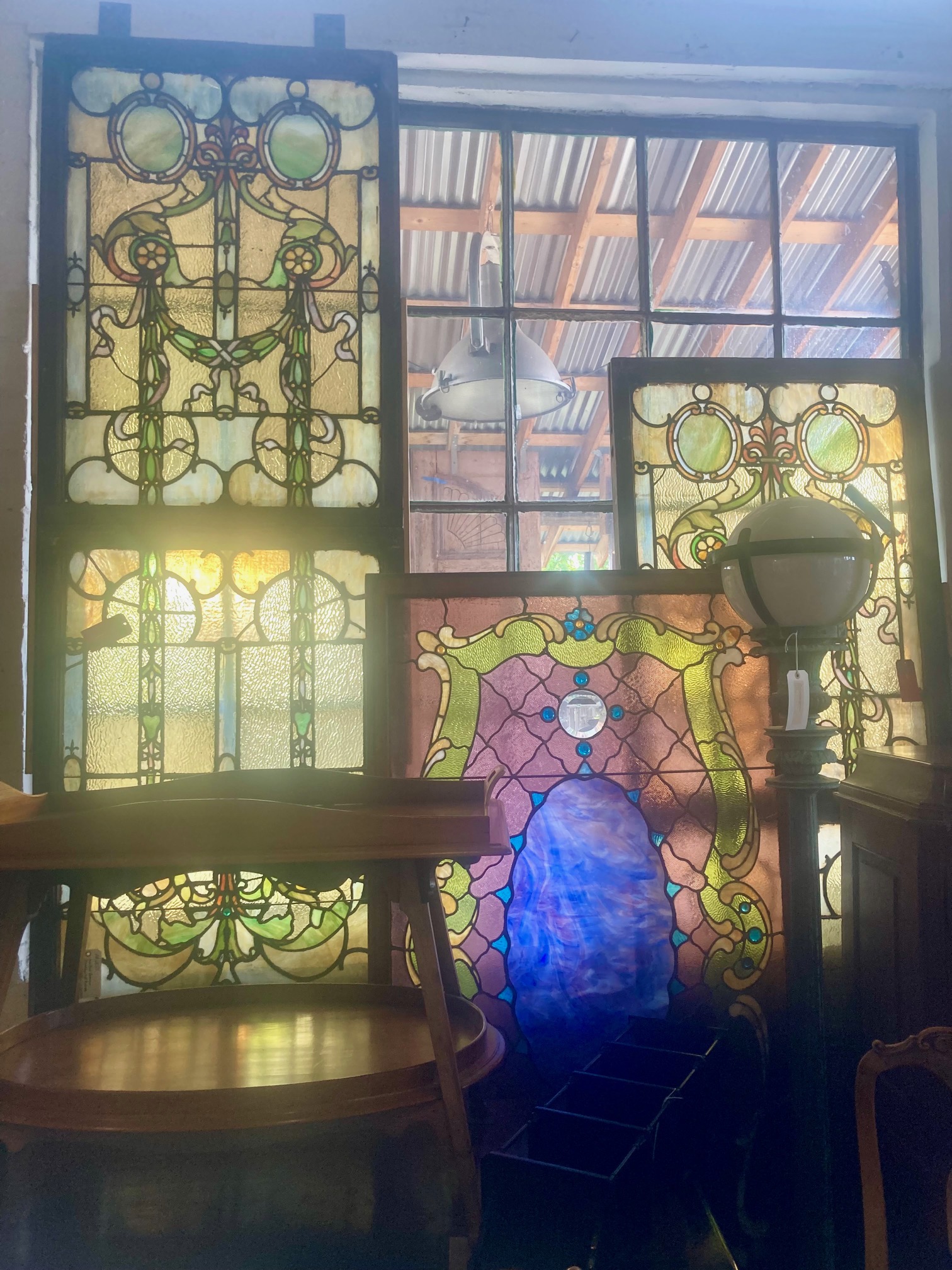 At age 15, Eron Johnson started acquiring and repairing stained glass windows and went on to amass an extensive collection of antiques. (Colleen Smith/Special to The Denver Gazette)