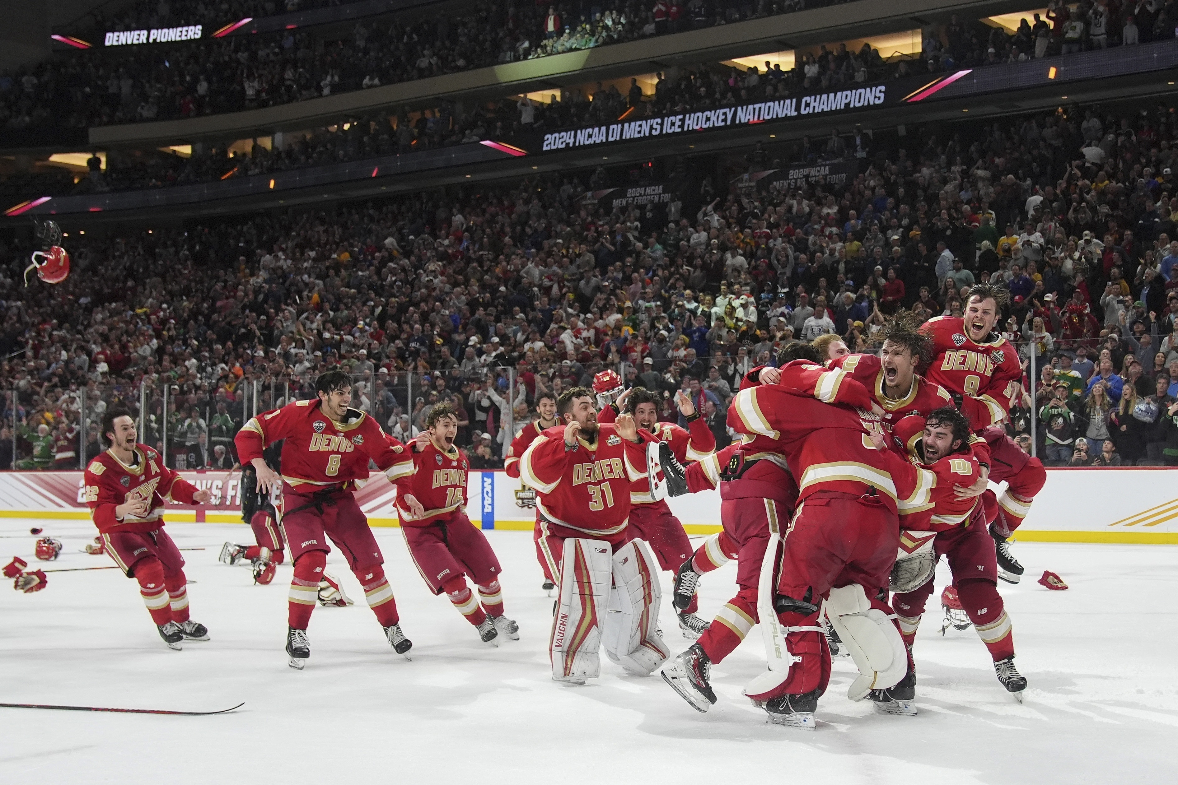 Denver celebrates after winning the championship game against Boston College in the Frozen Four NCAA college hockey tournament Saturday, April 13, 2024, in St. Paul, Minn. Denver won 2-0 to win the national championship. (AP Photo/Abbie Parr) (Abbie Parr)