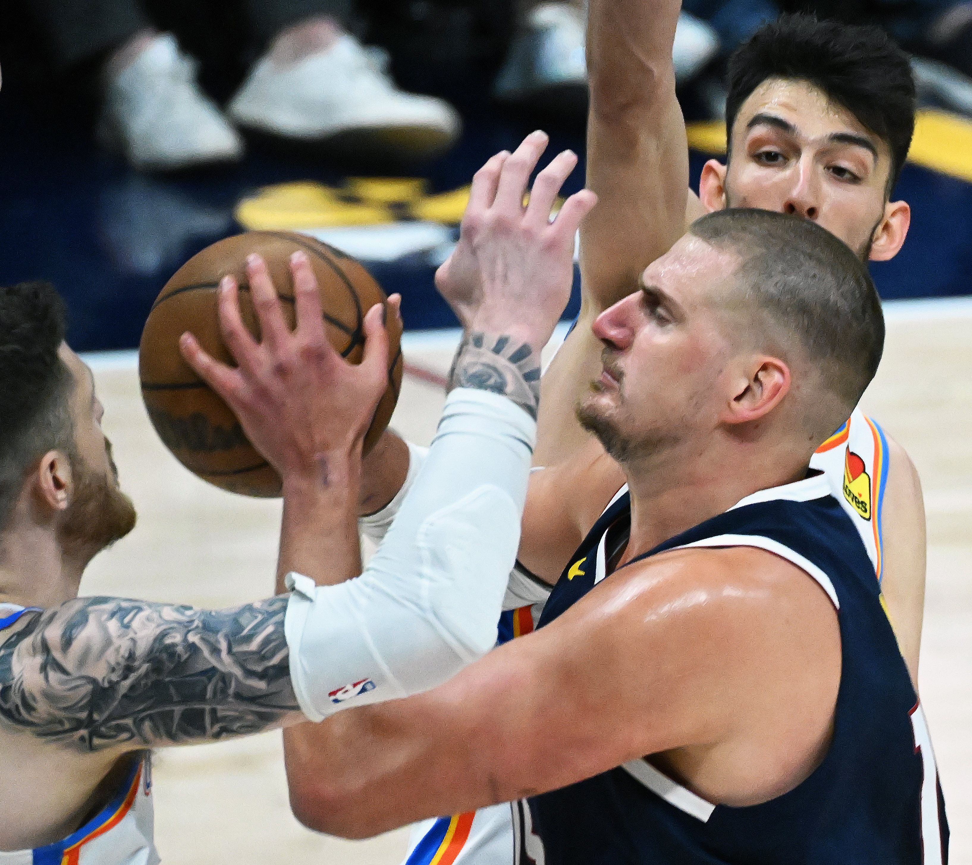 Denver Nuggets center Nikola Jokic (15) is defended by Oklahoma City Thunder center Isaiah Hartenstein (55) during the 1st quarter of game 4 of the second round of the Western Conference Championship at Ball Arena on Sunday, May 11, 2025. (Jerilee Bennett,The Gazette)