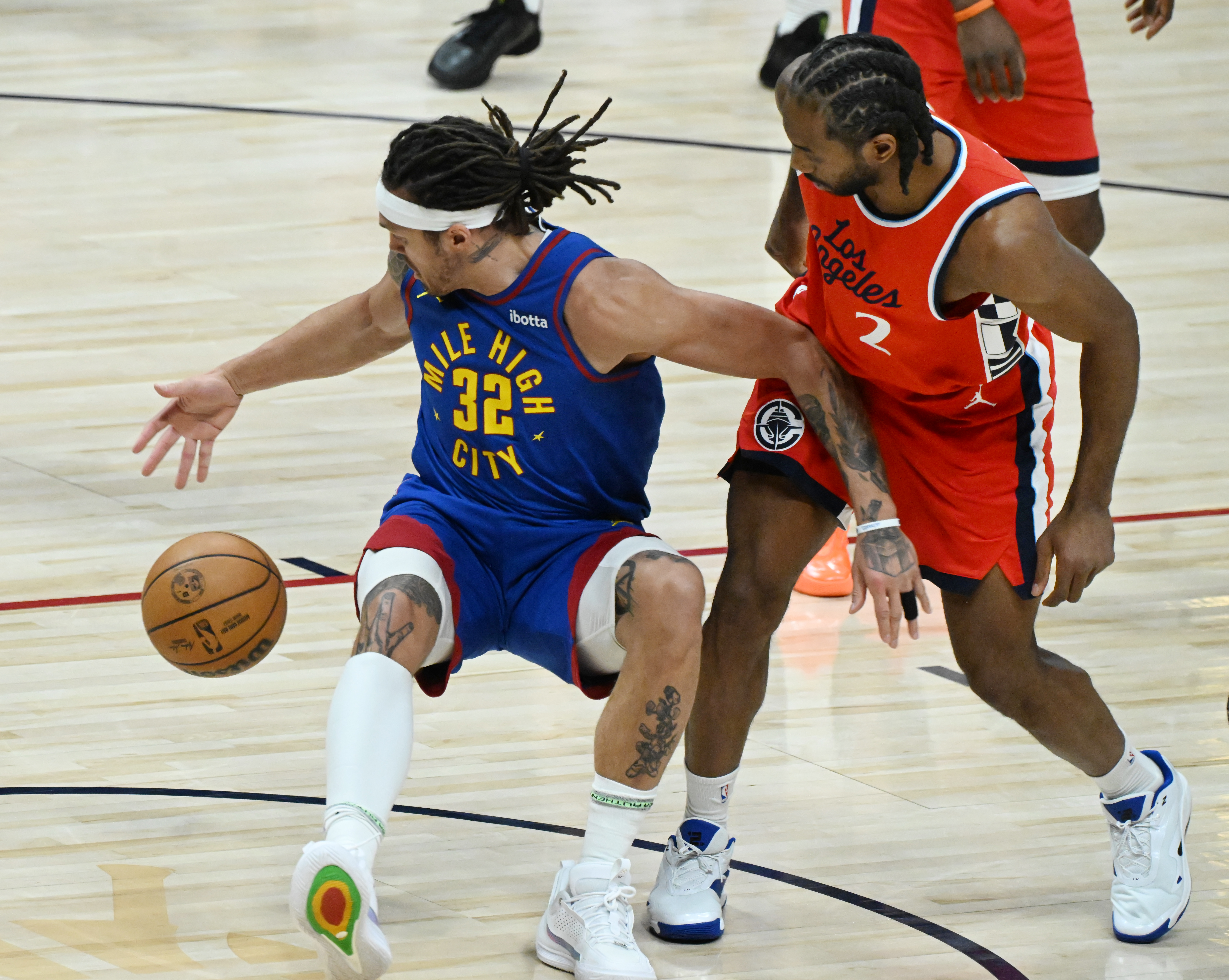 Denver Nuggets forward Aaron Gordon (32) temporarily loses the ball when being pressured by LA Clippers forward Kawhi Leonard (2) during the first quarter of game 7 in the first round of the Western Conference Championship on Saturday, May 3, 2025 at Ball Arena. (Jerilee Bennett,The Gazette)