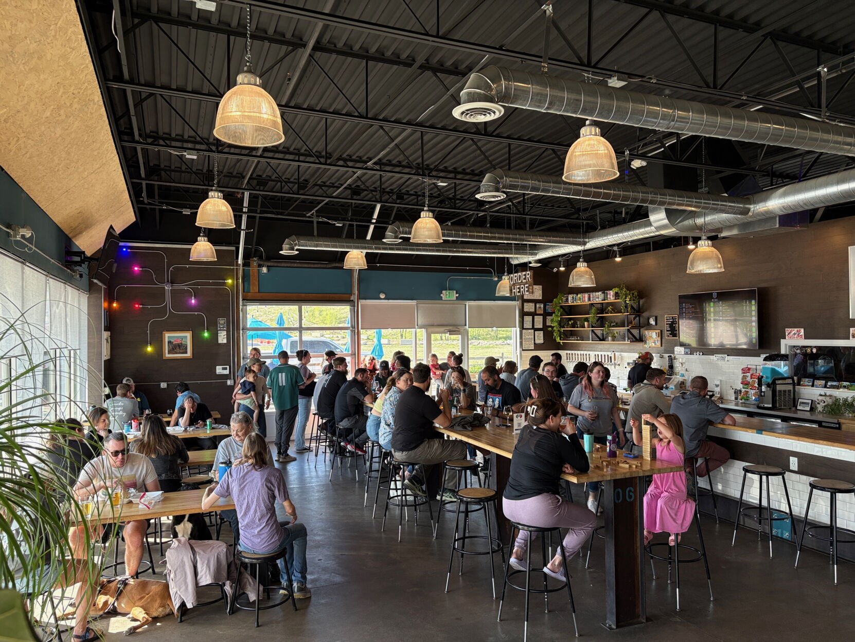 Crowds gather in Metric Brewing as the Knob Hill and surrounding communities show their support for the brewery. (Alexander Edwards, The Gazette)