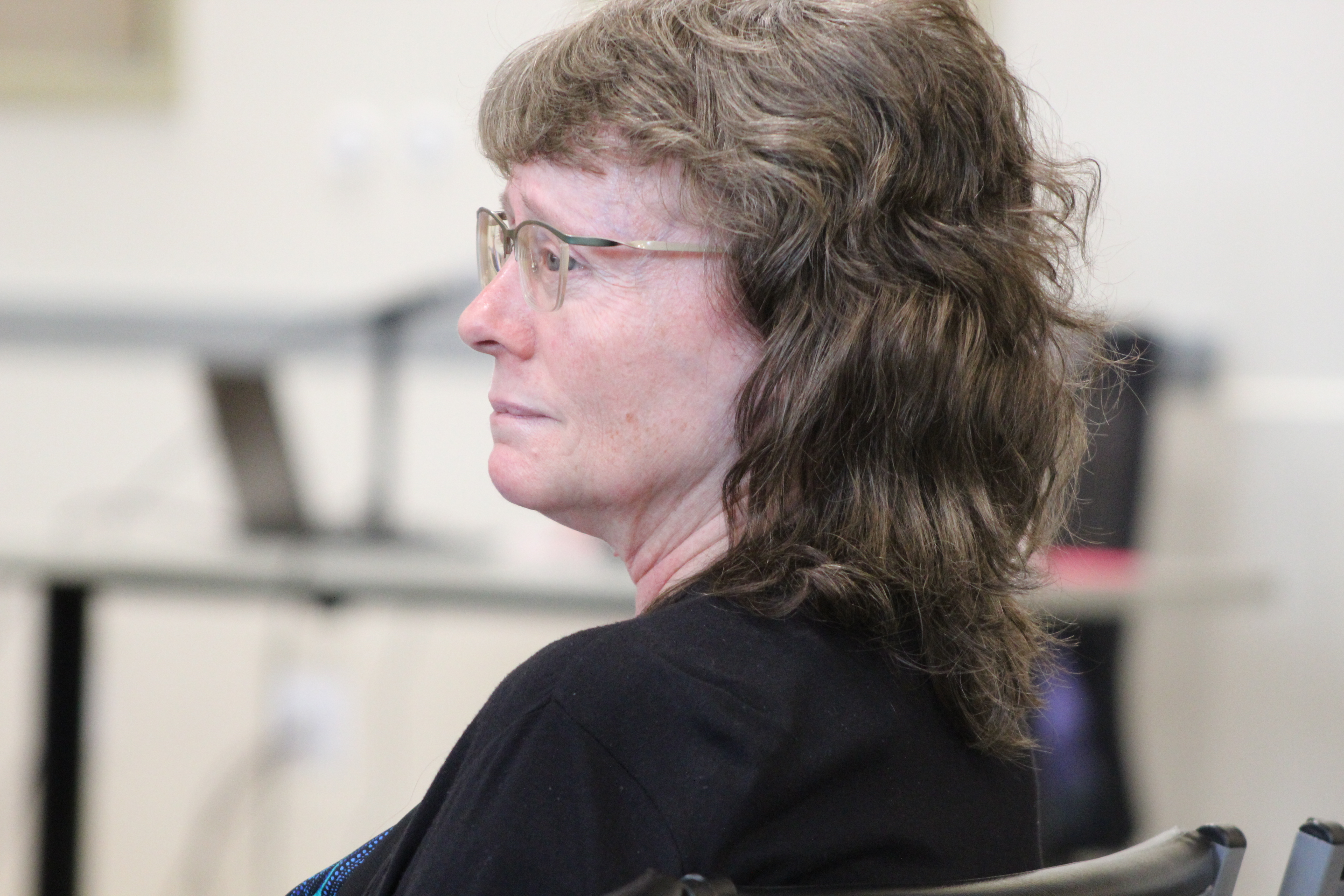 Former District Accountability Committee (DAC) Chair Karen Mortimer listens to a presentation on the budget recommendation for the upcoming budget on Thursday May 2, 2025.