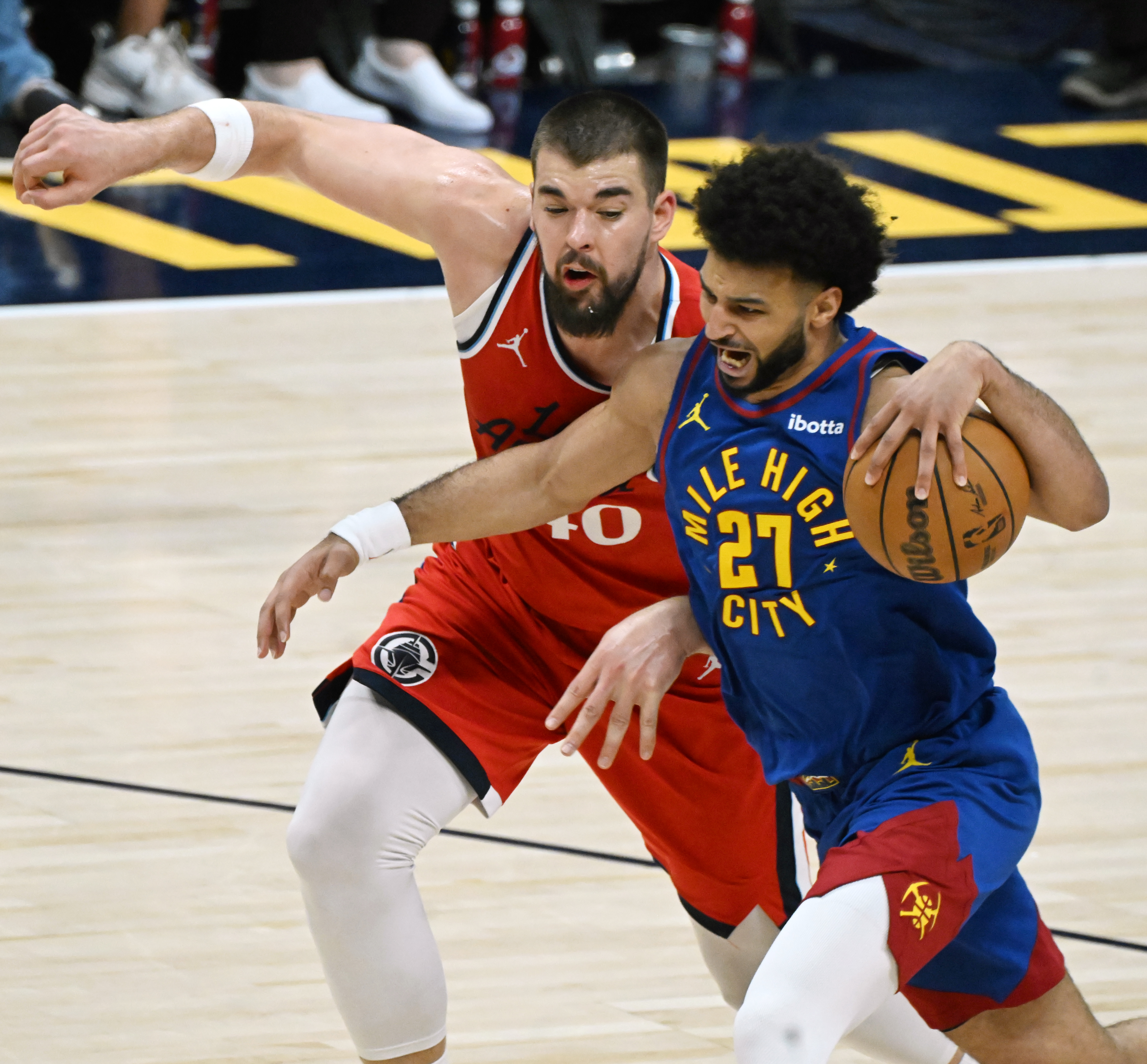 Denver Nuggets guard Jamal Murray (27) is defended by LA Clippers center Ivica Zubac (40) during the 4th quarter of Game 7 of Round 1 of the Western Conference Championship on Saturday, April 3, 2025. The Nuggets defeated the Clippers 120-101 and will play the Thunder in the second round. (Jerilee Bennett,The Gazette)
