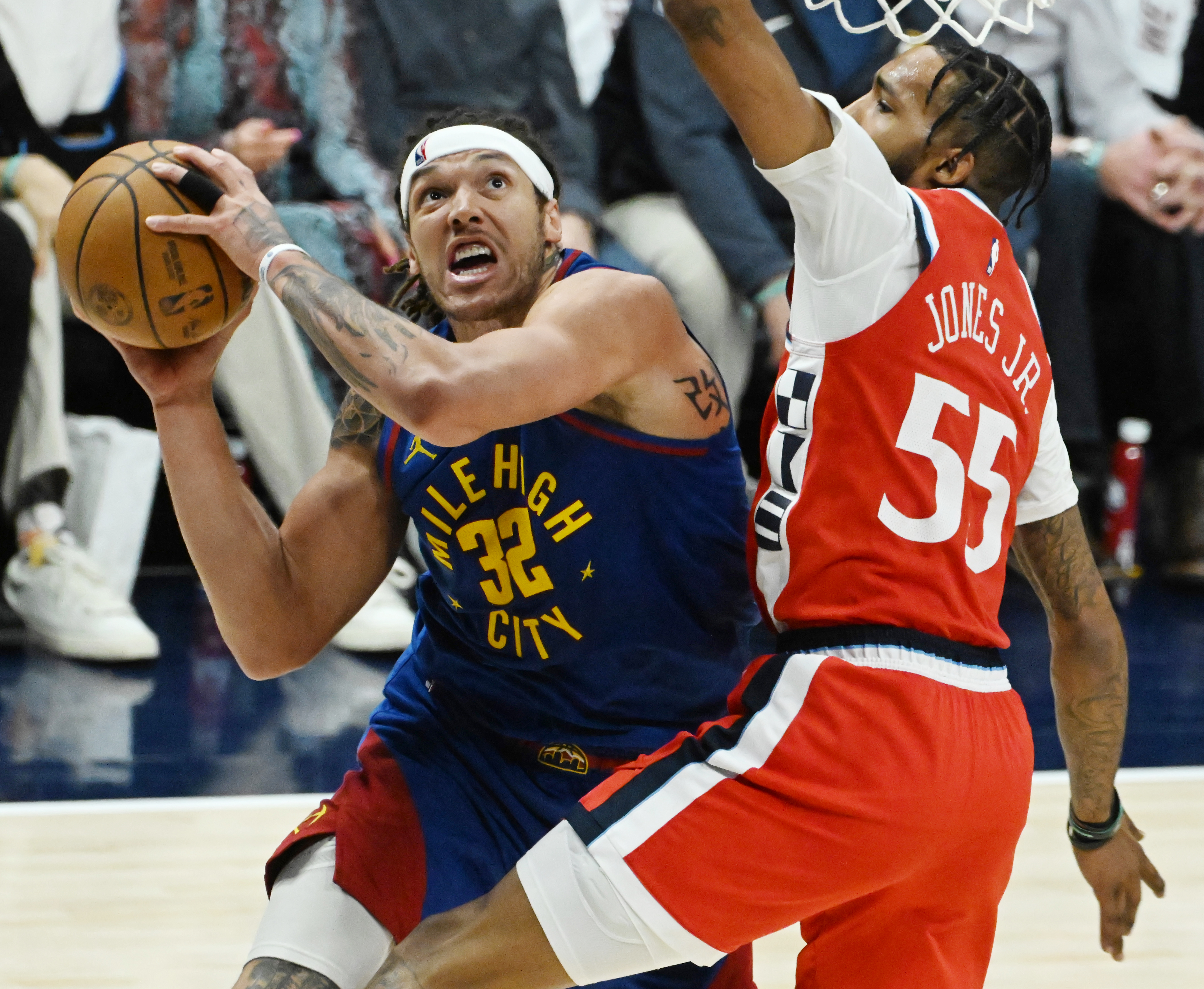 Denver Nuggets forward Aaron Gordon (32) shoots the ball while being guarded by LA Clippers forward Derrick Jones Jr. (55) during the 4th quarter of Game 7 of Round 1 of the Western Conference Championship on Saturday, April 3, 2025. The Nuggets defeated the Clippers 120-101 and will play the Thunder in the second round. (Jerilee Bennett, The Gazette)