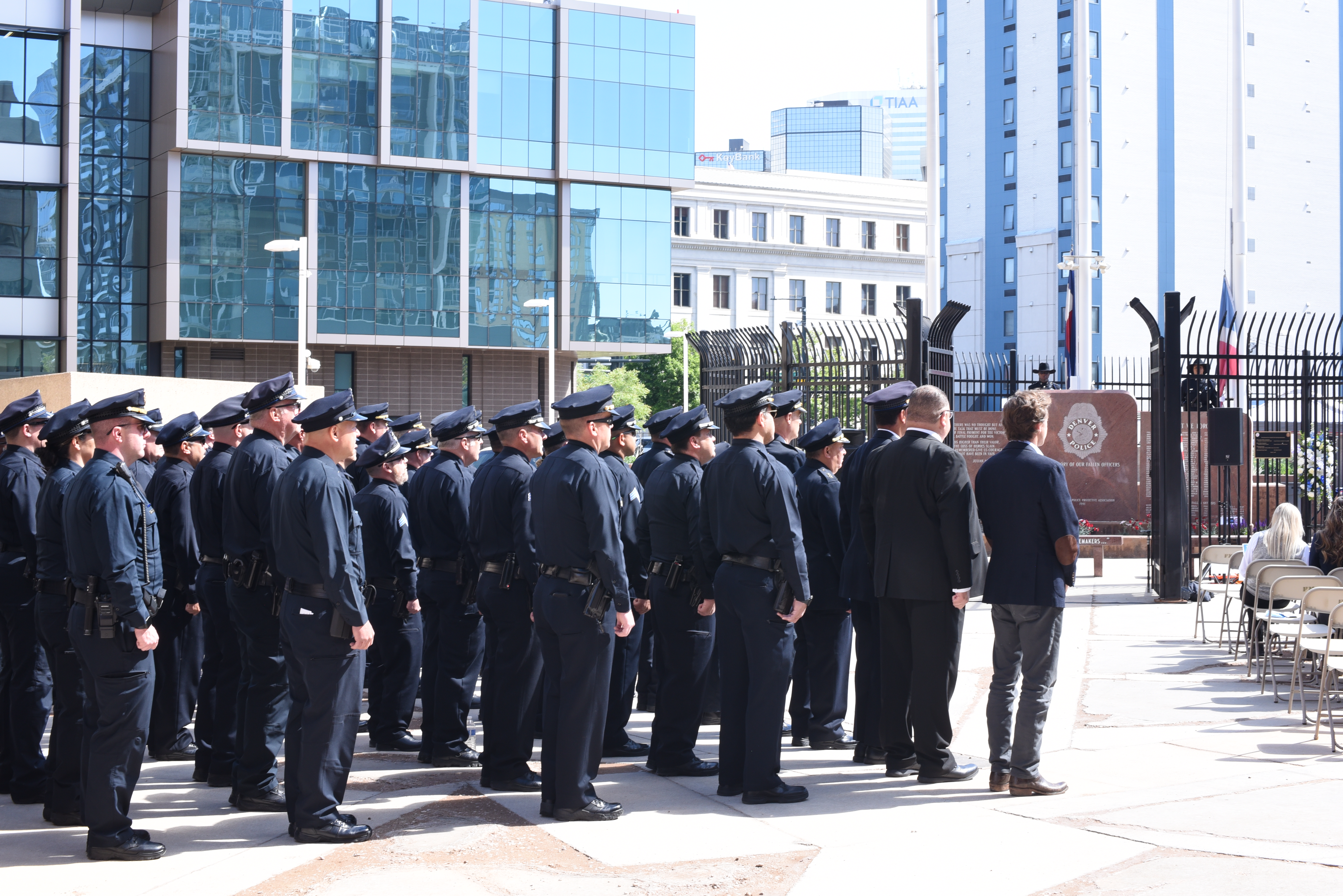 Denver Mayor Mike Johnston and Executive Director of Public Safety Armando Saldate stand next to Denver Police Department Chief Ron Thomas and in front of DPD officers in formation before the department's fallen officers memorial ceremony on Thursday, May 15. (Michael Braithwaite / The Denver Gazette) (Michael Braithwaite / The Denver Gazette)