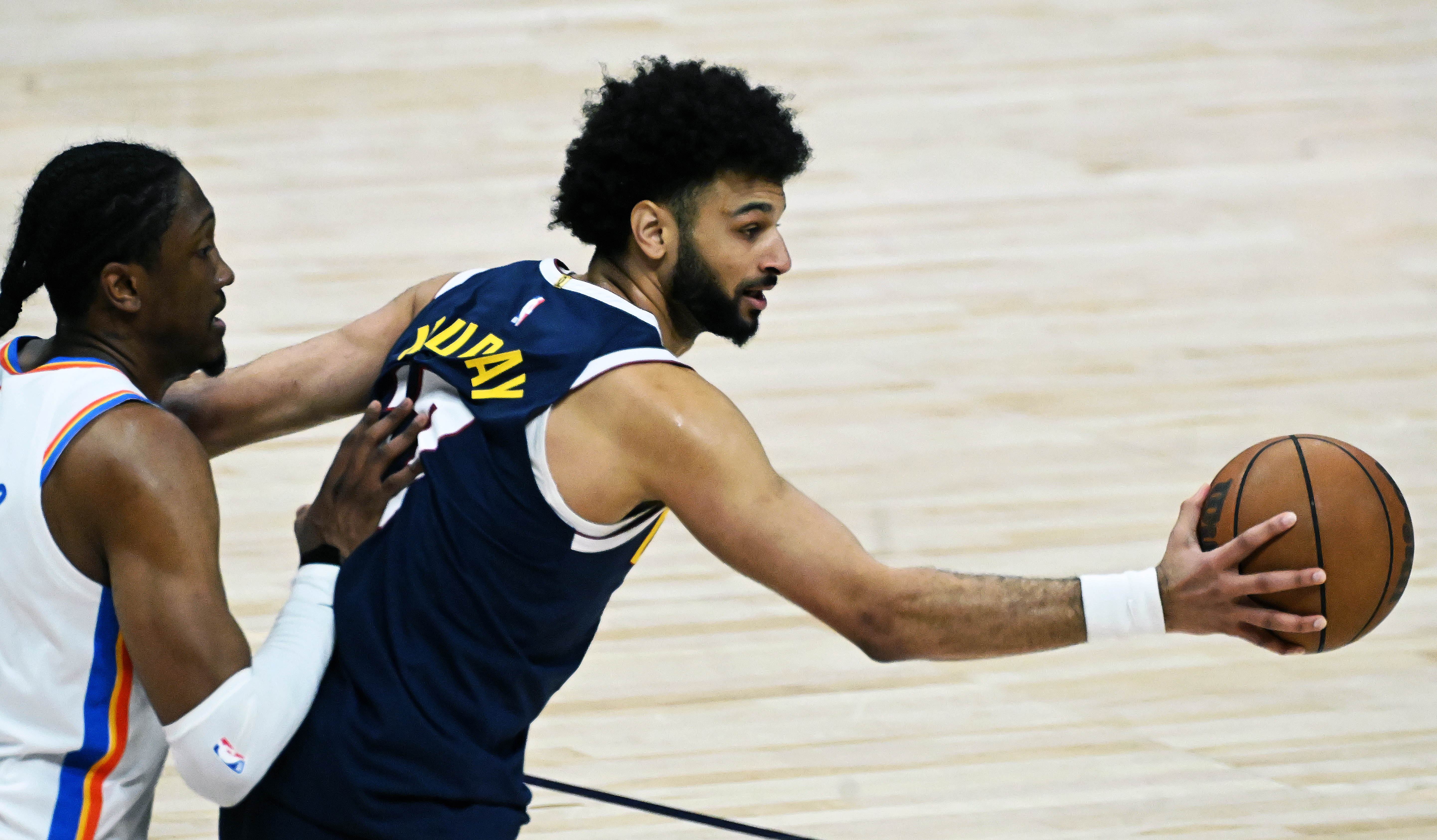Denver Nuggets guard Jamal Murray (27) reaches out to hand off the ball during the 1st quarter of game 4 of the second round of the Western Conference Championship at Ball Arena on Sunday, May 11, 2025. (Jerilee Bennett,The Gazette)