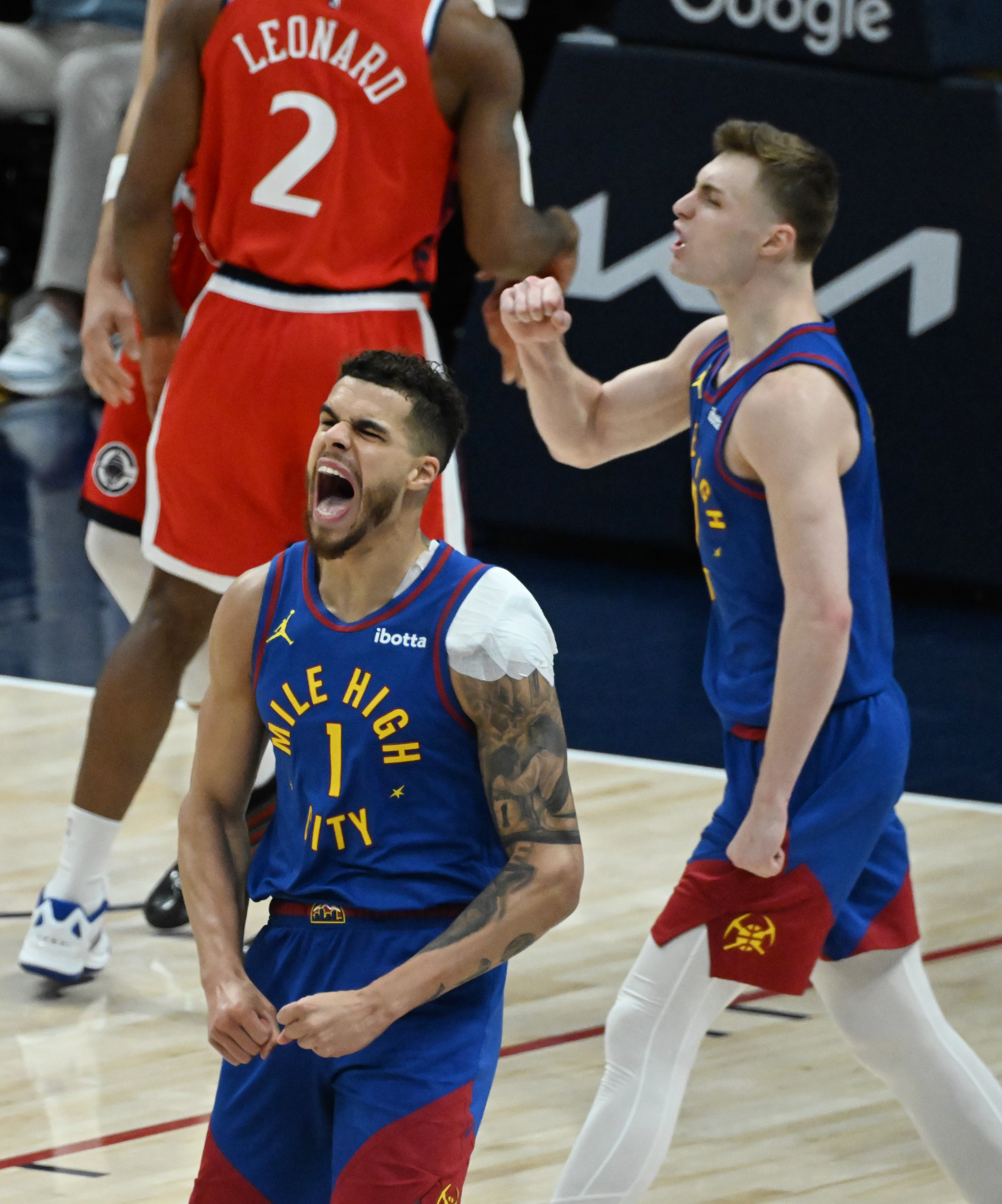 Denver Nuggets forward Michael Porter Jr. (1) celebrates a basket with Denver Nuggets guard Christian Braun (0) during the third quarter as the Nuggets started their rout of the Clippers in Game 7 of Round 1 of the Western Conference Championship on Saturday, April 3, 2025. The Nuggets defeated the Clippers 120-101 and will play the Thunder in the second round. (Jerilee Bennett,The Gazette)
