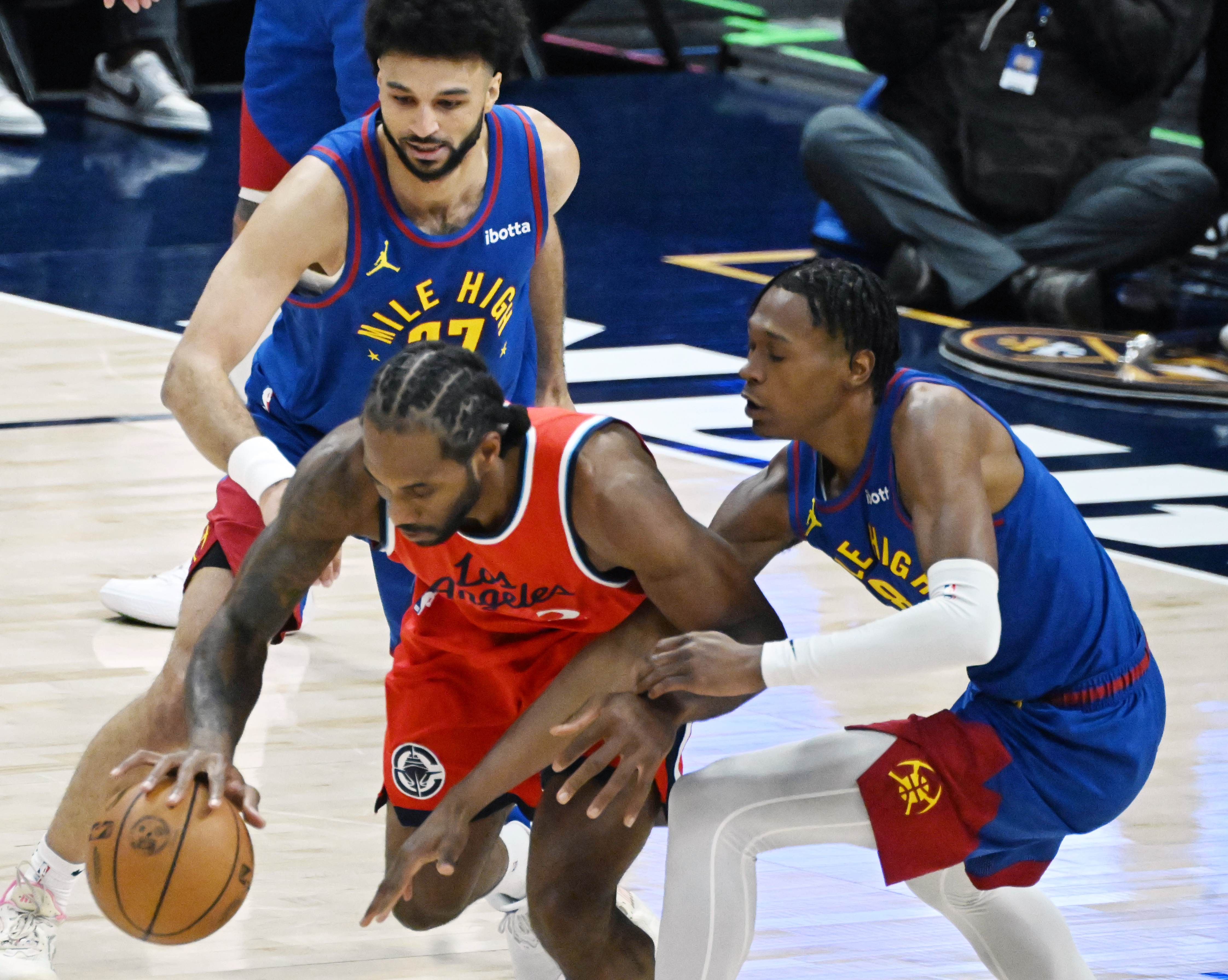 Denver Nuggets guard Jamal Murray (27) and Denver Nuggets forward Peyton Watson (8) pressure LA Clippers forward Kawhi Leonard (2) during the second quarter of game 7 against the Clippers in the first round of the Western Conference Championship on Saturday, May 3, 2025 at Ball Arena. (Jerilee Bennett,The Gazette)