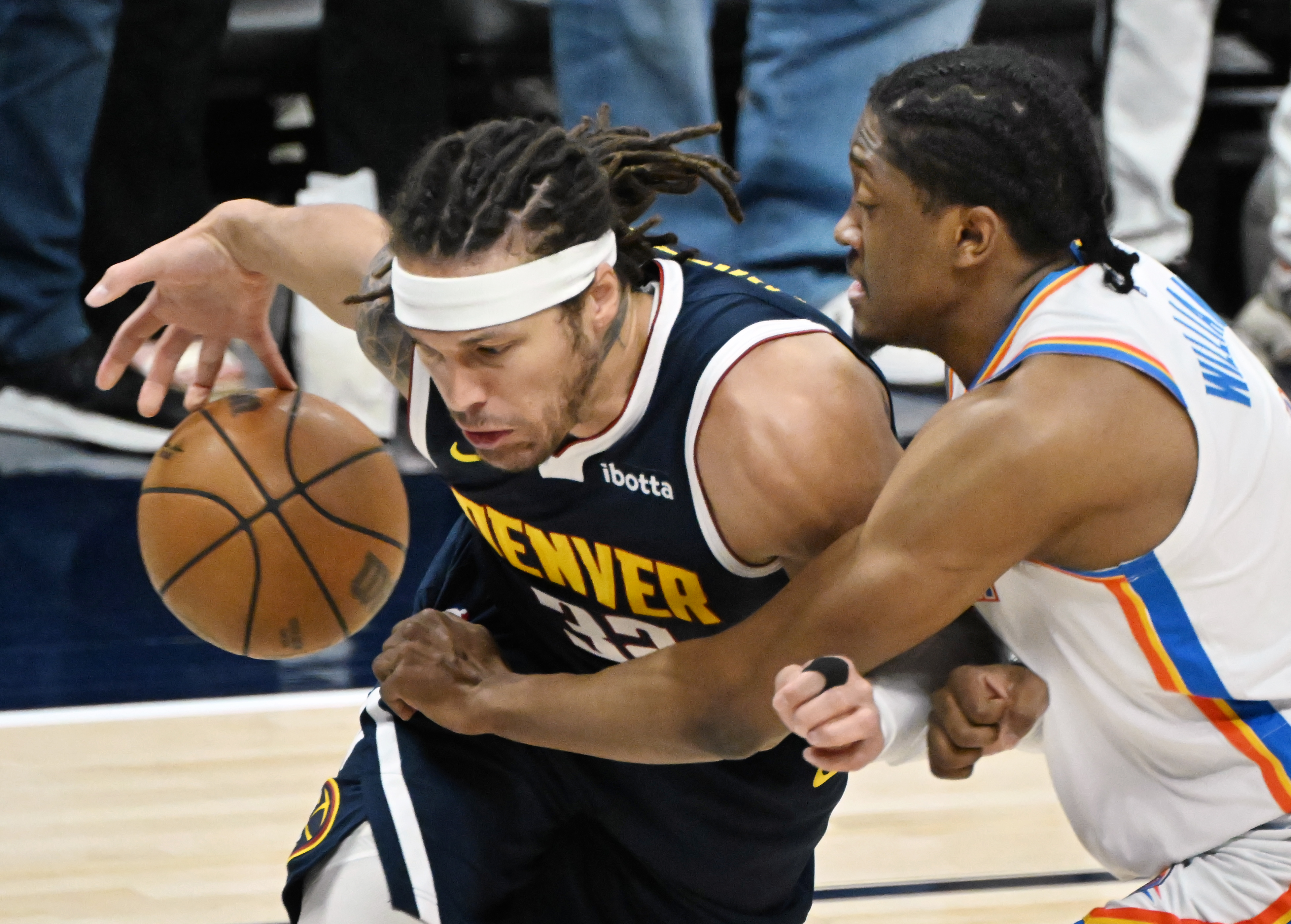 Denver Nuggets forward Aaron Gordon (32) gets the ball knocked away by Oklahoma City Thunder forward Jalen Williams (8) during the 1st quarter of game 4 of the second round of the Western Conference Championship at Ball Arena on Sunday, May 11, 2025. (Jerilee Bennett,The Gazette)