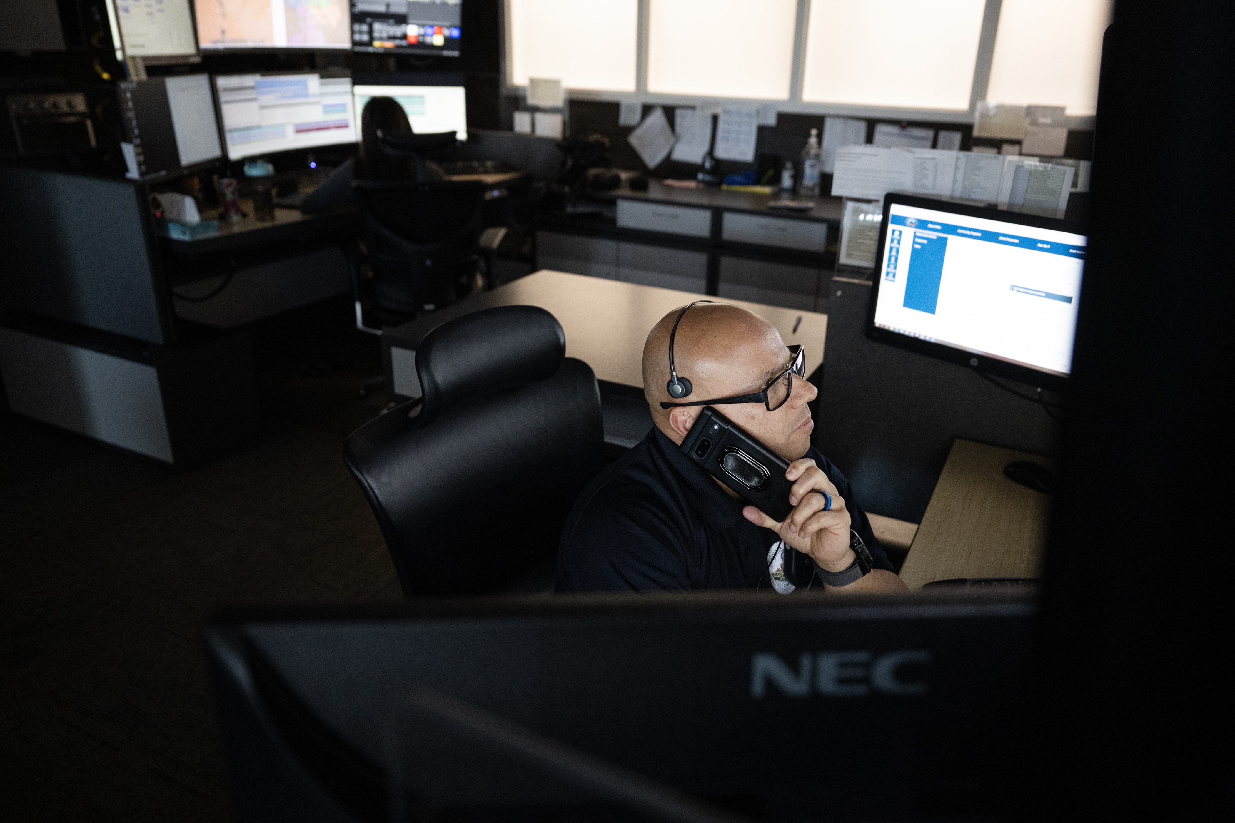 Castle Rock Police Department Officer Adrian Mendez talks with an officer in the field about a suspect vehicle that may be coming into town as he keeps an eye on an array of computer monitors flagging suspected stolen vehicles via the Flock Safety license plate recognition cameras mounted around the city on Tuesday, Feb. 13, 2024, in the Strategic Response Center at the department’s headquarters in Castle Rock, Colo. (Timothy Hurst/Denver Gazette) (TimHursttim.hurst@gazette.comhttps://secure.gravatar.com/avatar/aca82bd62b4ee425c598527cd6faa1b1?d=mm&r=g)