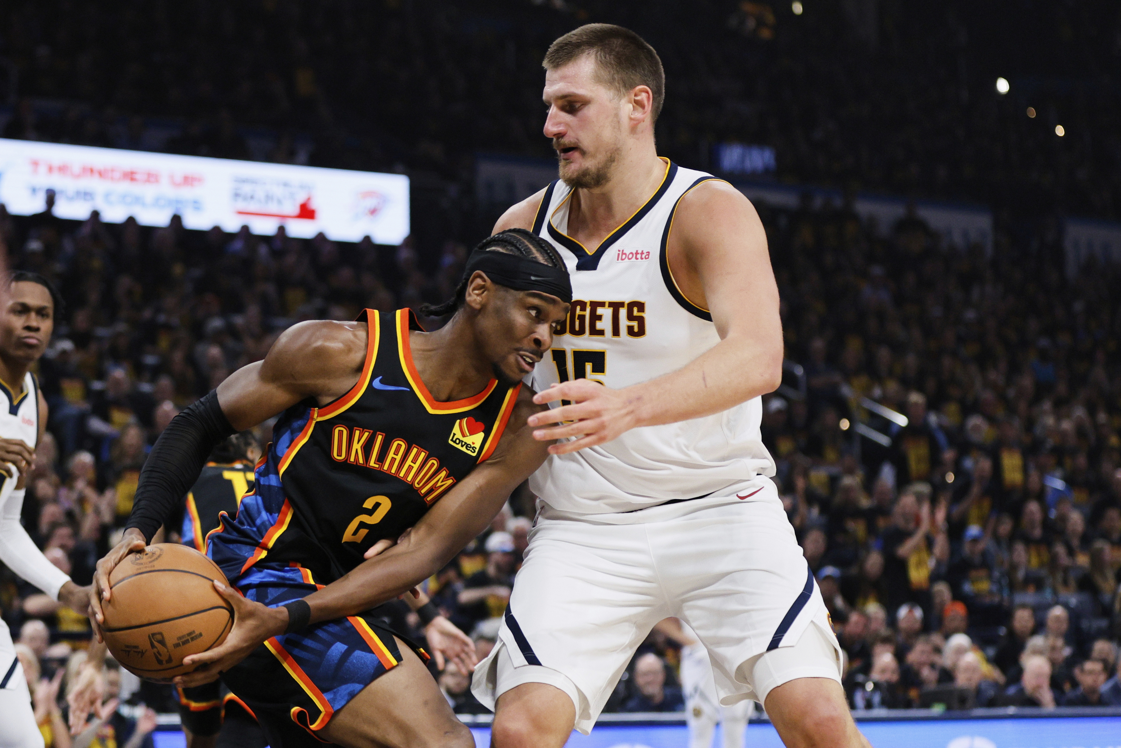 Oklahoma City Thunder guard Shai Gilgeous-Alexander (2) works against Denver Nuggets center Nikola Jokic (15) in the first half of Game 1 of an NBA basketball second-round playoff series Monday, May 5, 2025, in Oklahoma City. (AP Photo/Nate Billings) (Nate Billings)