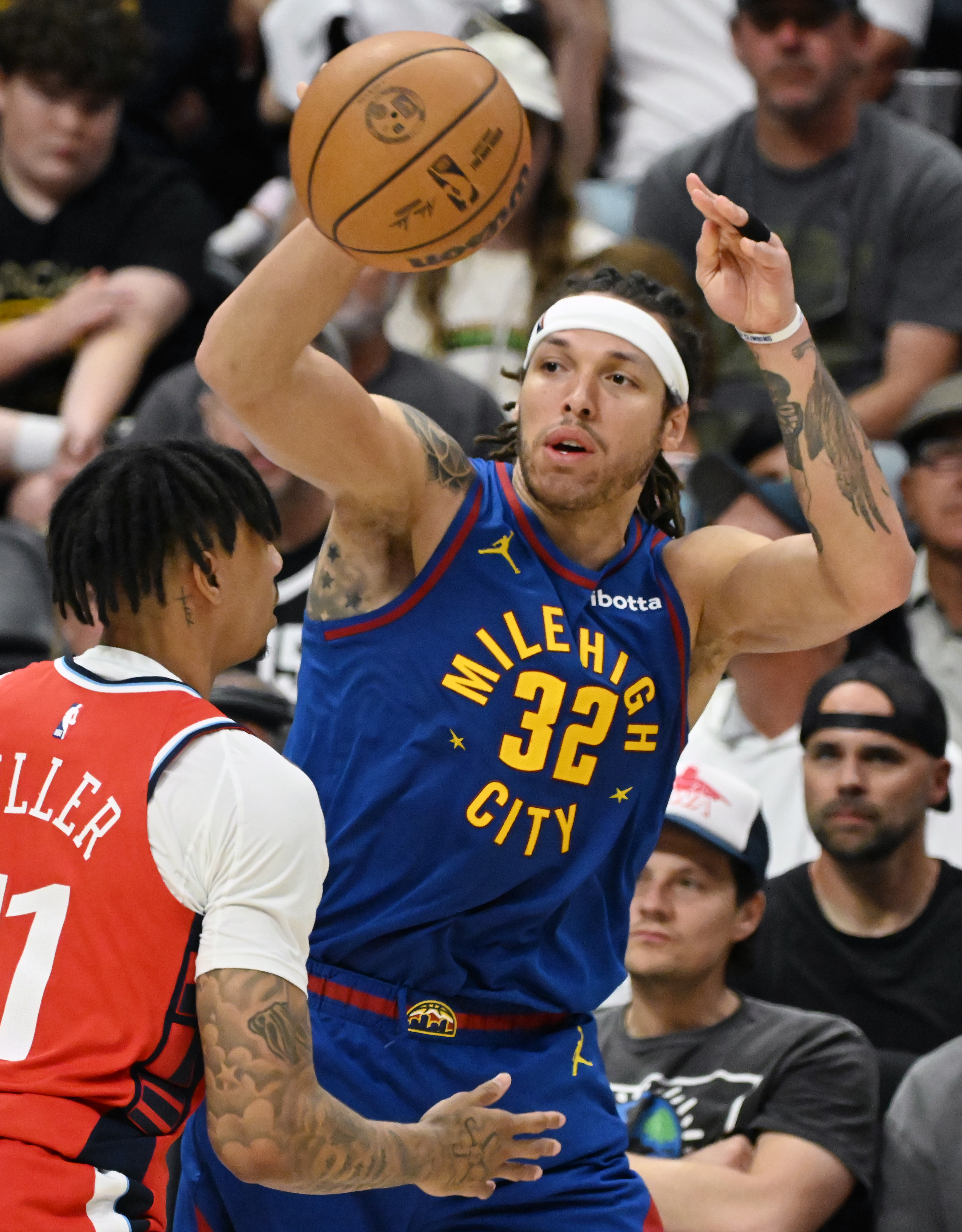 Denver Nuggets forward Aaron Gordon (32) passes the ball past LA Clippers guard Jordan Miller (11) during the 4th quarter of Game 7 of Round 1 of the Western Conference Championship on Saturday, April 3, 2025. The Nuggets defeated the Clippers 120-101 and will play the Thunder in the second round. (Jerilee Bennett,The Gazette)
