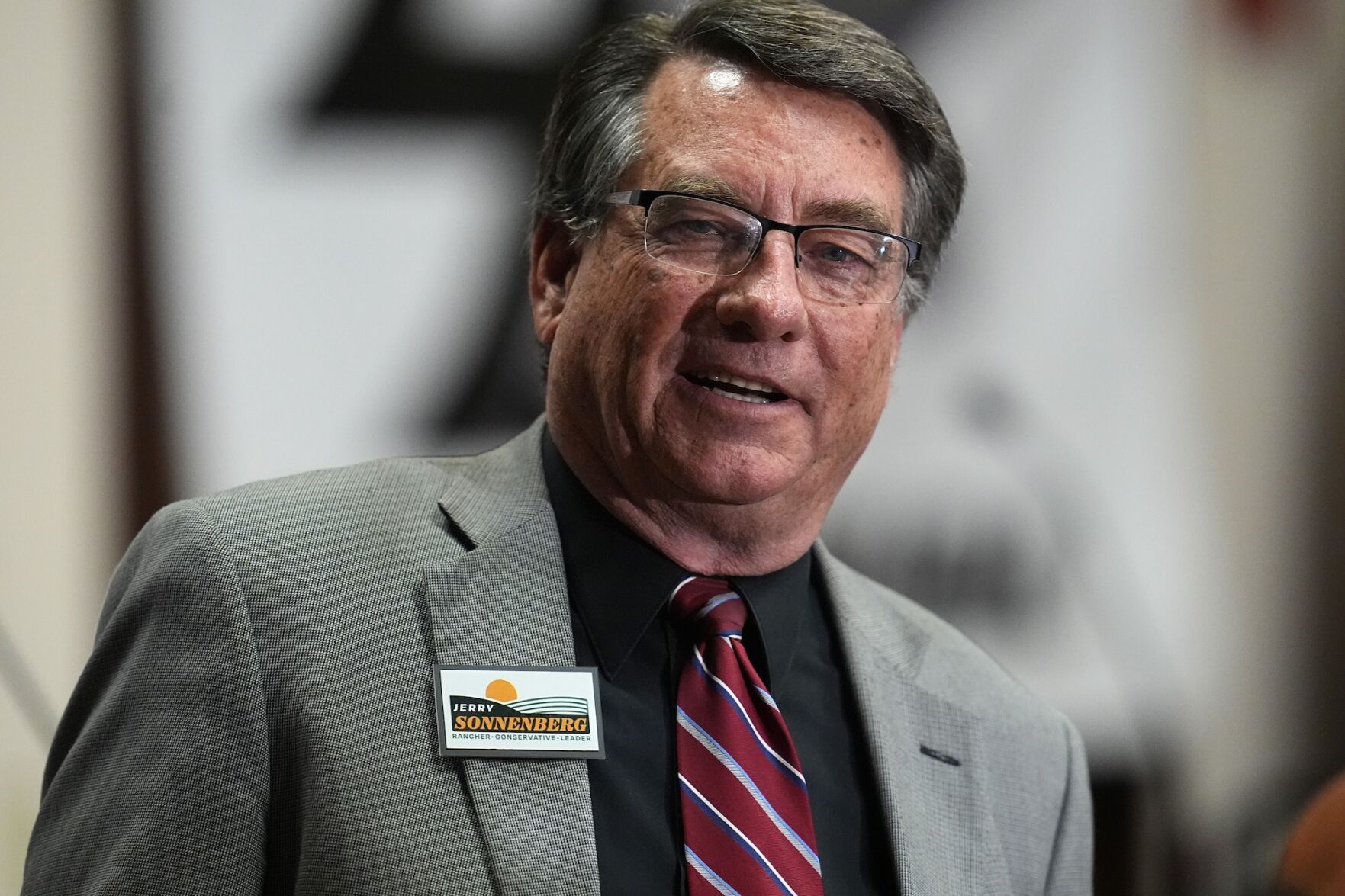 In this file photo, former Colorado state Sen. Jerry Sonnenberg talks to well-wishers before the first Republican primary debate for the 4th Congressional district seat being vacated by Ken Buck on Jan. 25, 2024, in Fort Lupton. ((AP Photo/David Zalubowski))