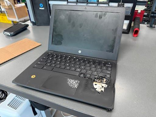 A photo showing the damage a Boulder Valley School District student inflicted on their computer by attempting to short-circuit it or puncture the lithium battery. Image courtesy of Randy Barber, Boulder Valley School District (Courtesy of Randy Barber, Boulder Valley School District)
