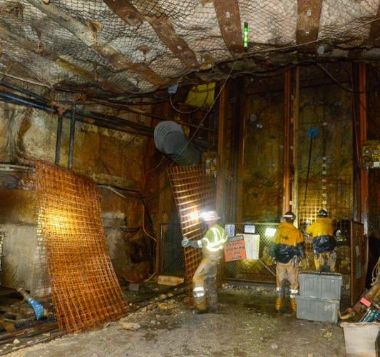Three miners unload steel grating at the Pinyon Plain Mine.jpg (copy)