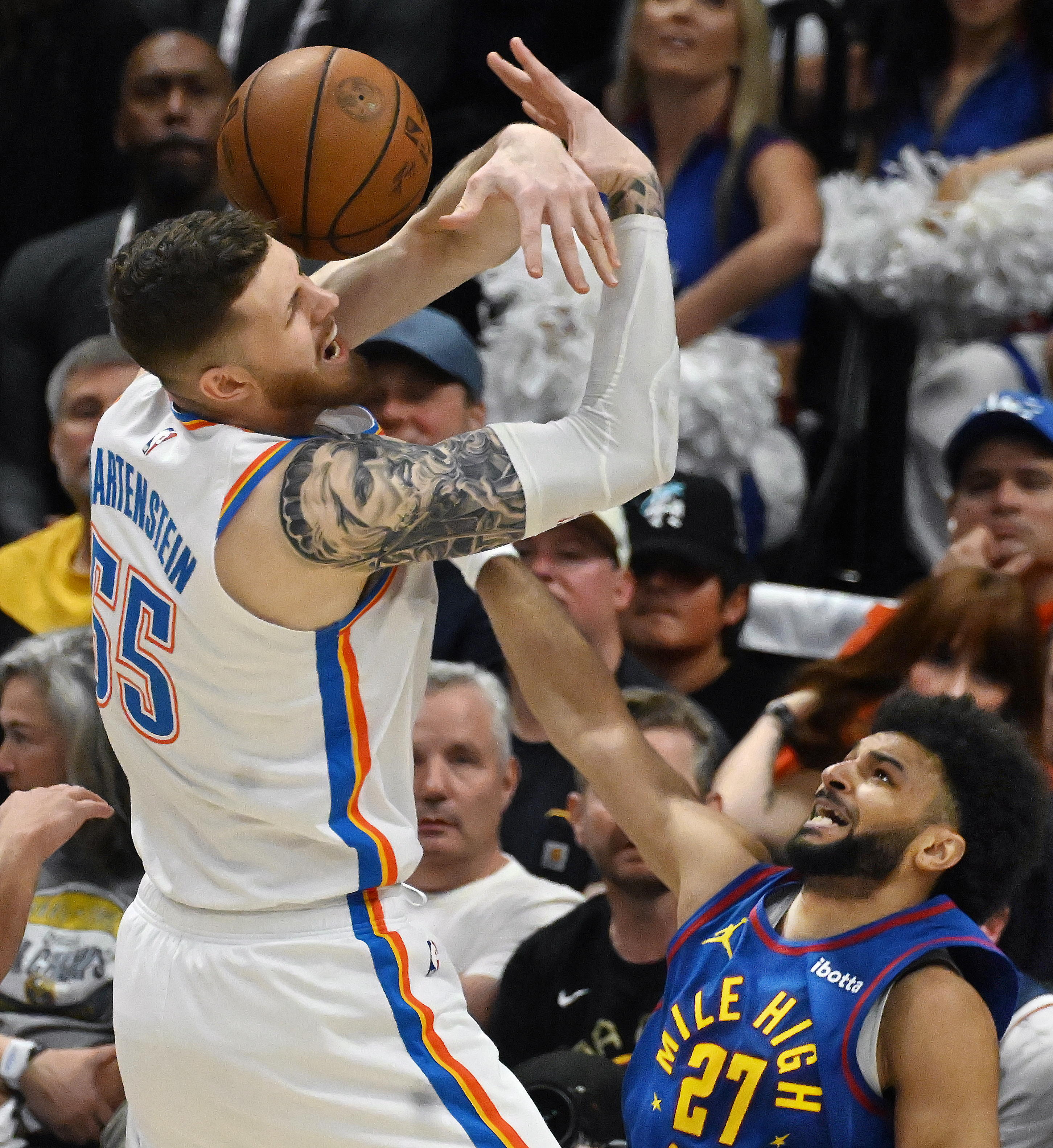 Denver Nuggets guard Jamal Murray (27) knocks the ball away from Oklahoma City Thunder center Isaiah Hartenstein (55) during the first quarter of game 3 of round 2 of the Western Conference Championship at Ball Arena on Friday, May 9, 2025. (Jerilee Bennett,The Gazette)