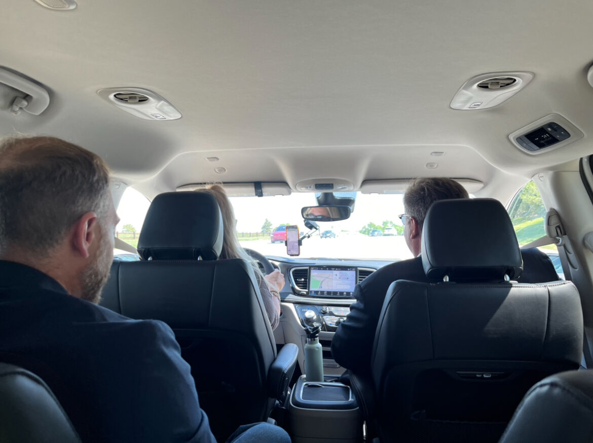Inside Via Transportation Linked on Demand vehicle with Douglas County commissioners