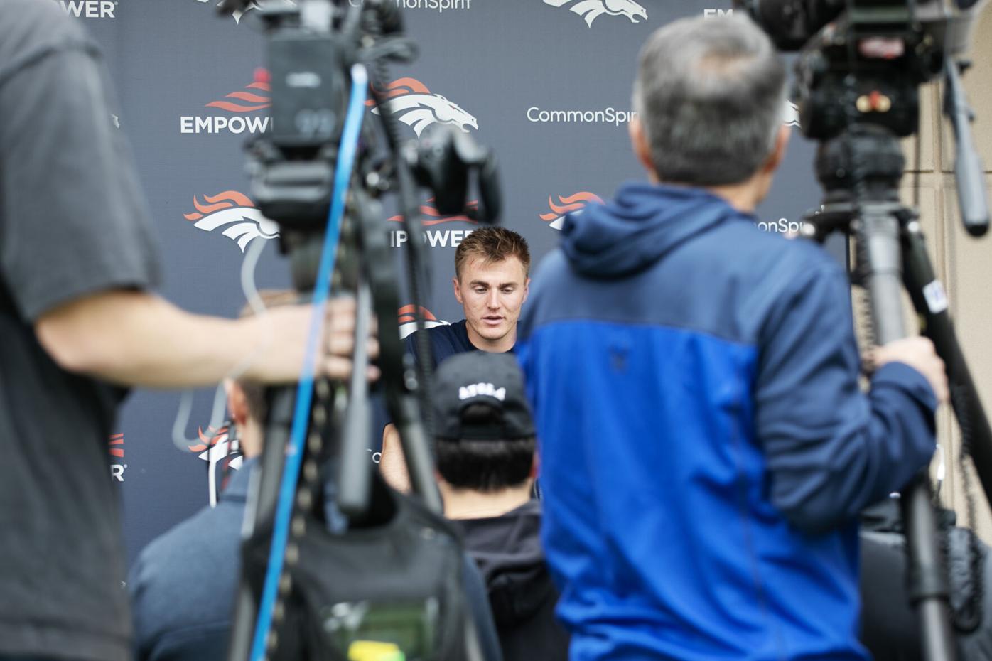 Bo Nix speaks to members of the media during Broncos OTAs