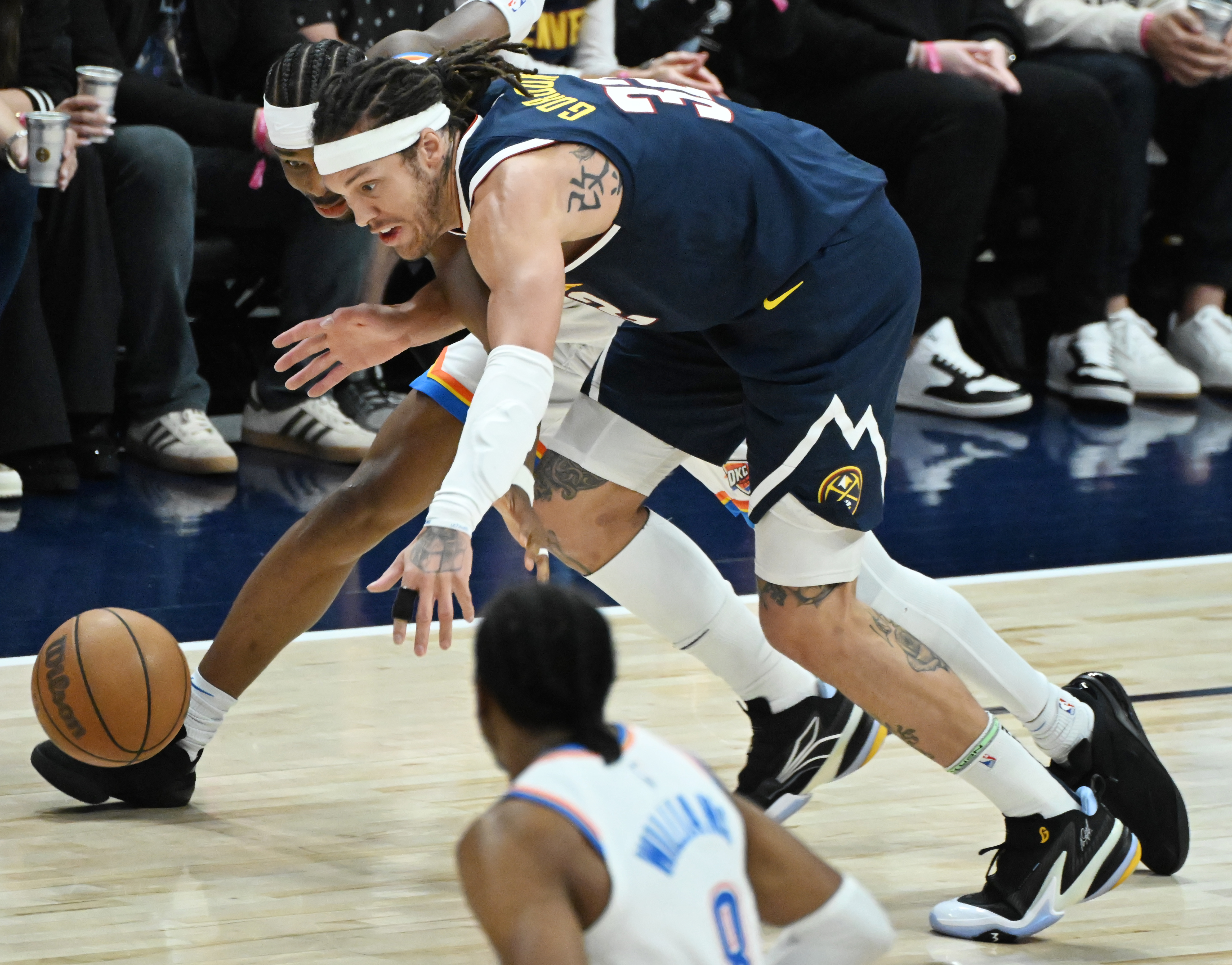 Denver Nuggets forward Aaron Gordon (32) knocks the ball away from Oklahoma City Thunder guard Shai Gilgeous-Alexander (2) during the 1st quarter of game 4 of the second round of the Western Conference Championship at Ball Arena on Sunday, May 11, 2025. (Jerilee Bennett,The Gazette)