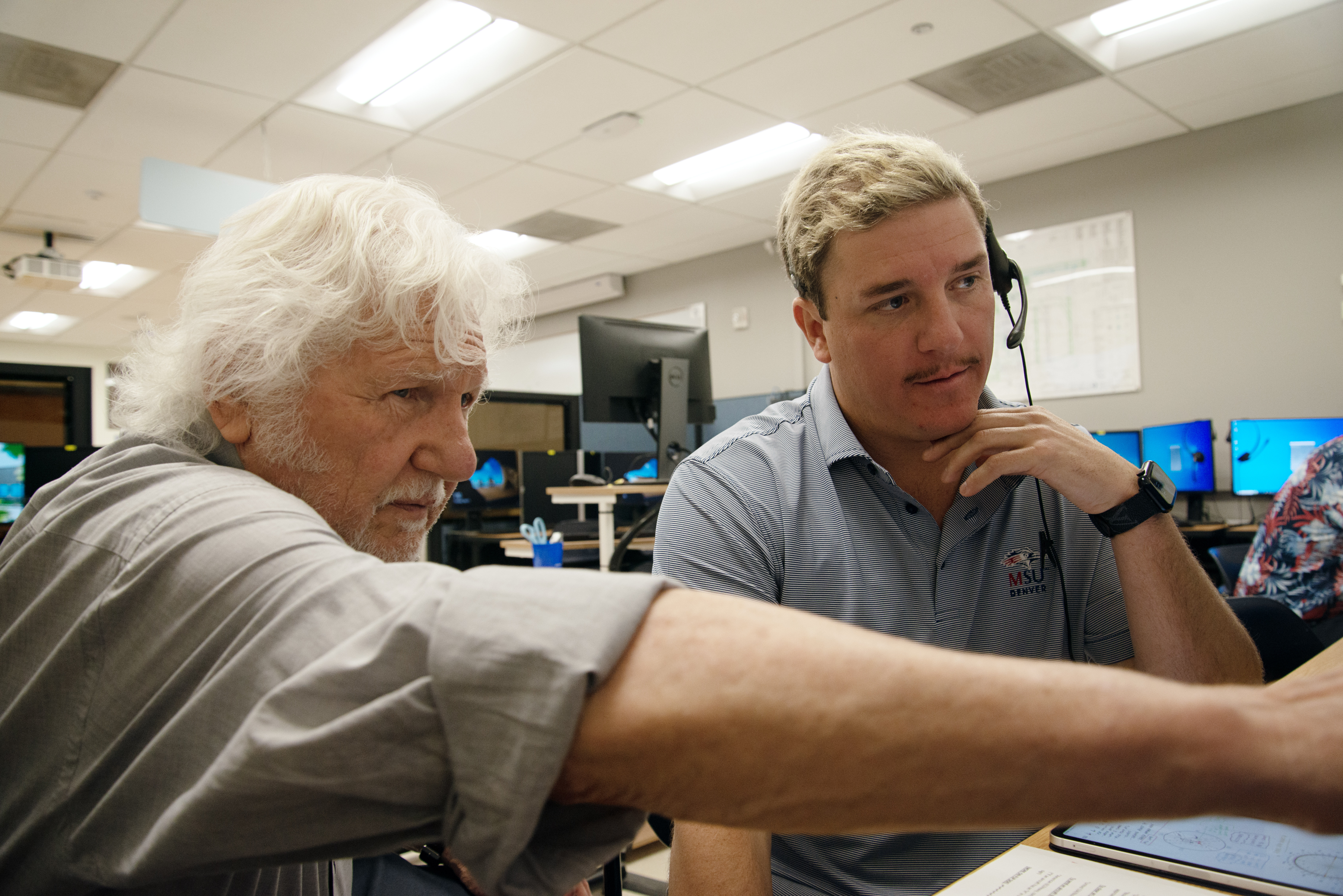 Professor Tom Obarski talks to Alex Edwards, a student in the MSU Denver air traffic control concentration, during a simulation exercise in the classroom on Thursday, May 15, 2025. (TomHellauerMultimedia Producertom.hellauer@denvergazette.comhttps://denvergazette.com/content/tncms/avatars/f/9e/622/f9e6228a-3b6b-11ed-bf10-fbb71fa8e421.f54b911252c540f1d61709edc4727a39.png)