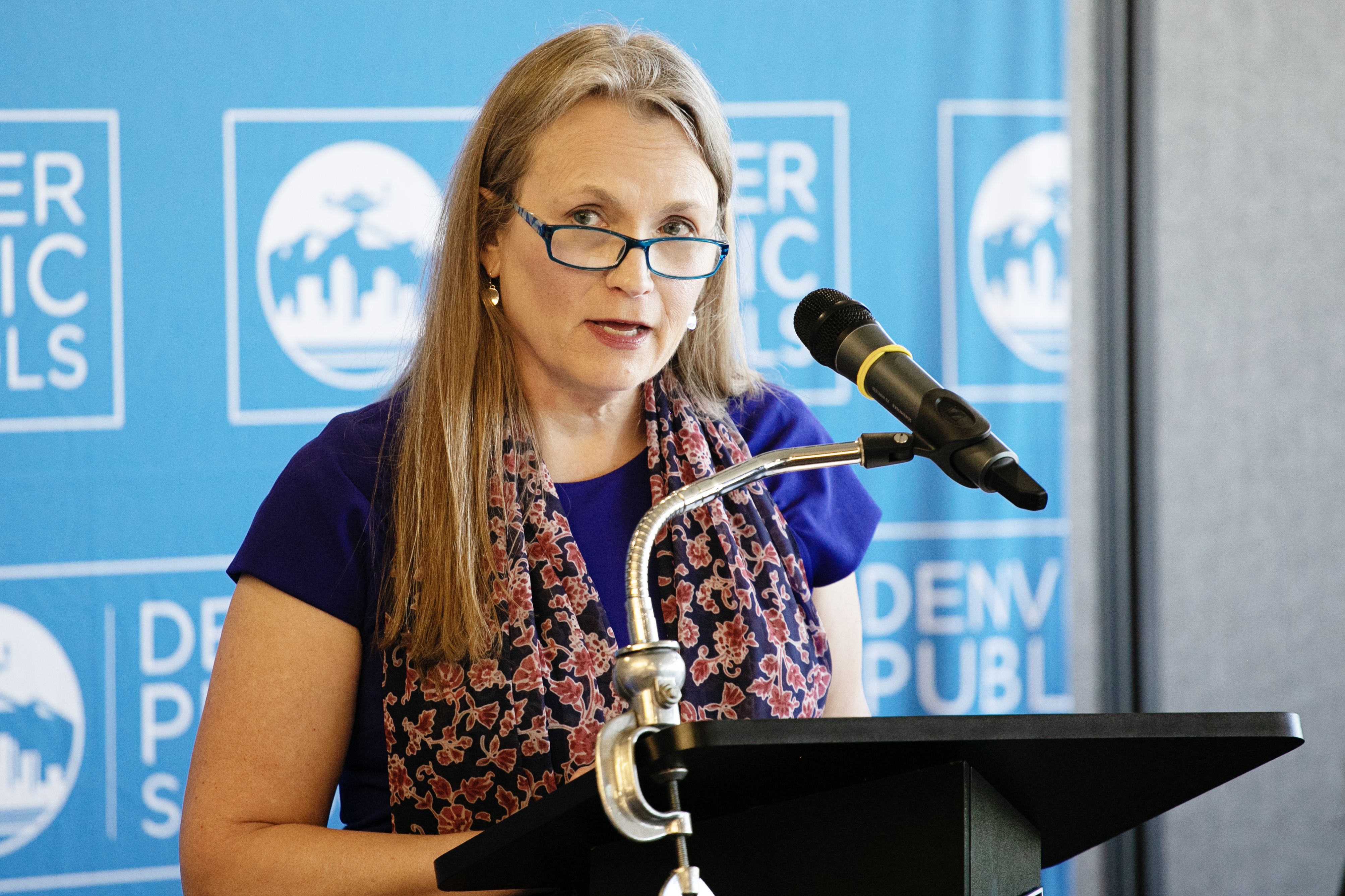 FILE PHOTO: Dr. Carrie Olson, president of the Denver Public Schools Board of Education, addresses members of the media and educators regarding the findings of the