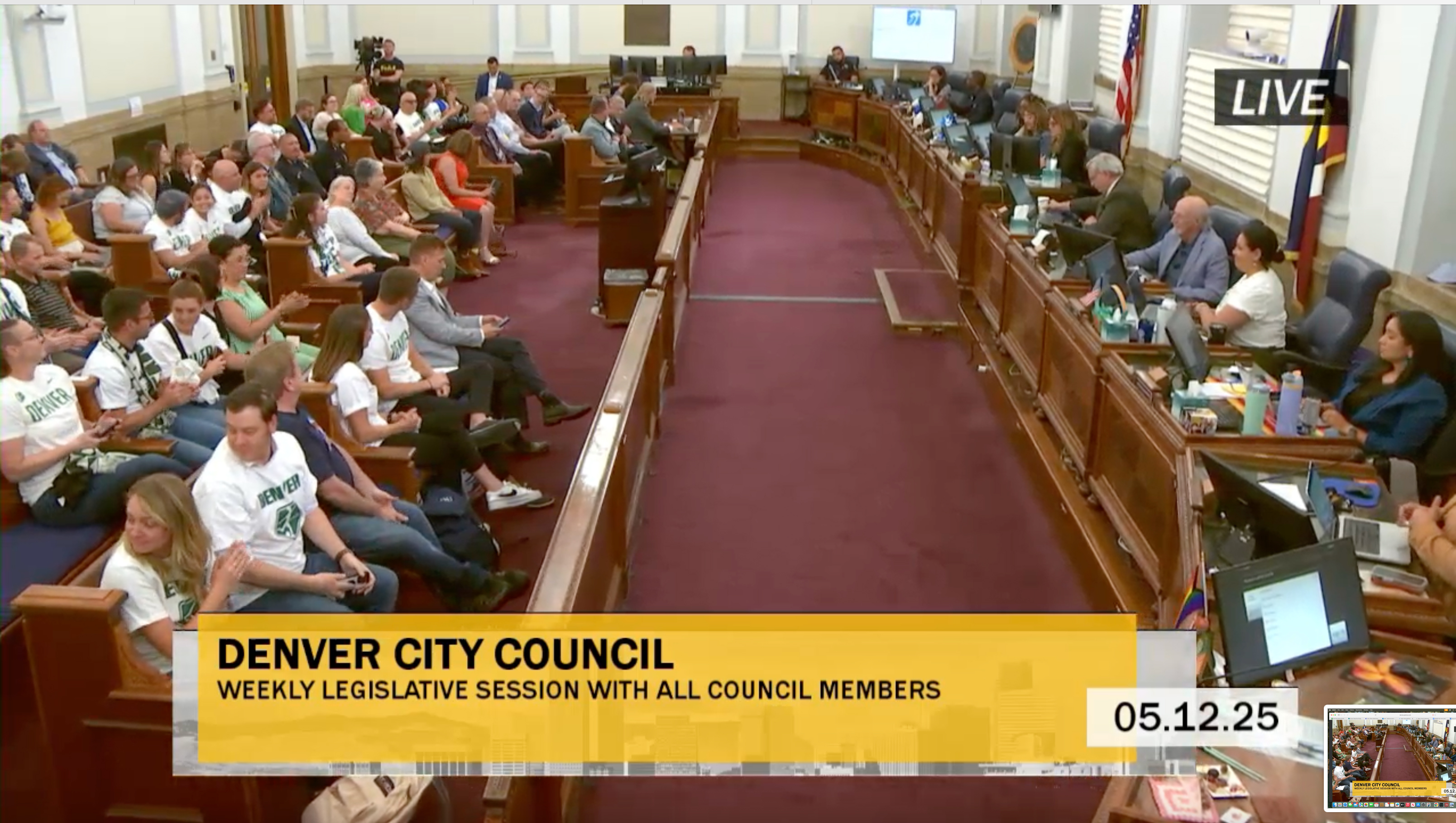 Denver City Council chambers erupts in applause after the councilmembers approved an intergovernmental agreement moving the city closer to a NWSL stadium project (City of Denver screengrab)