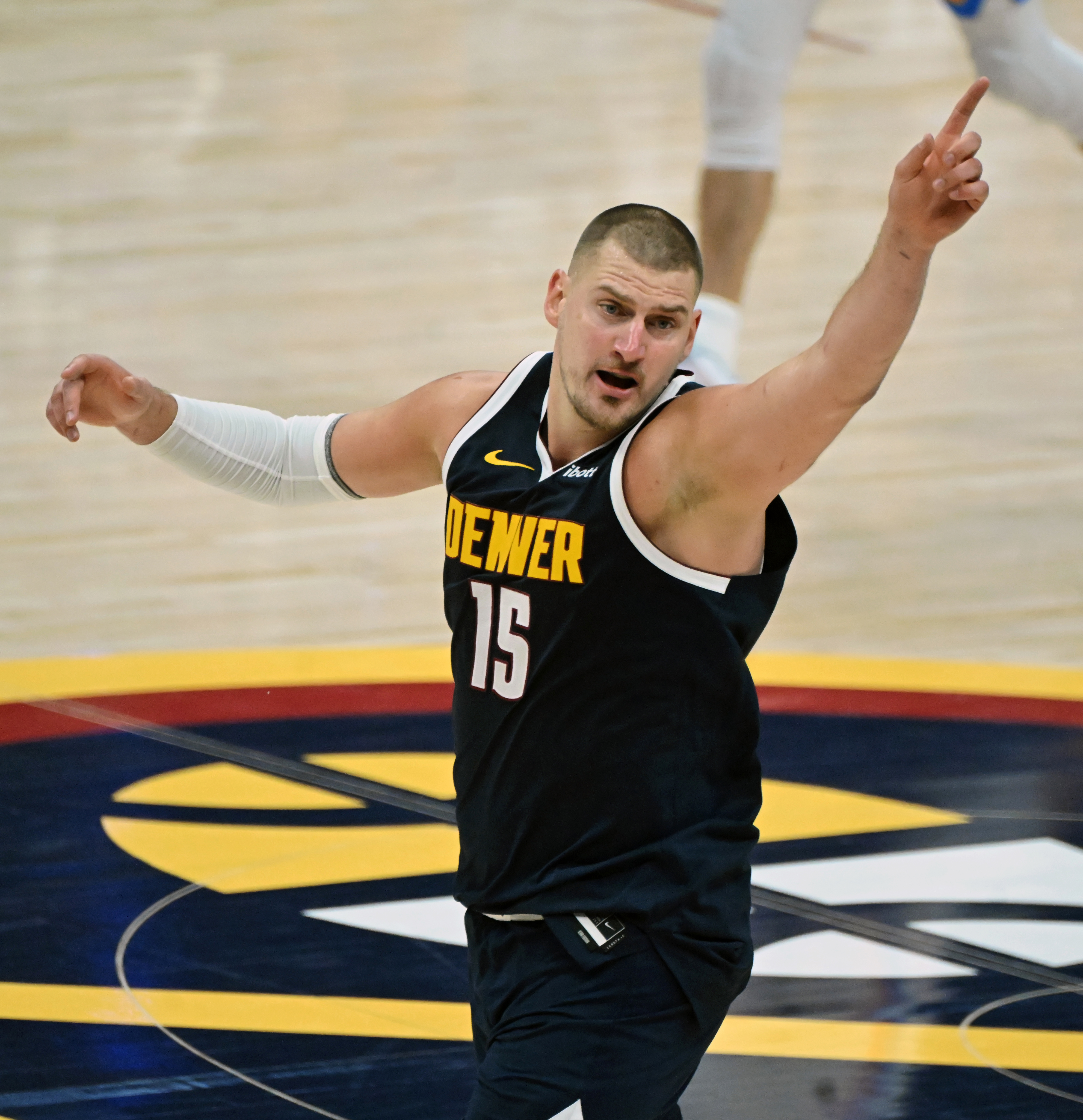 Denver Nuggets center Nikola Jokic (15) points to the crowd after making 3 points during the 3rd quarter of game 4 of the second round of the Western Conference Championship at Ball Arena on Sunday, May 11, 2025. (Jerilee Bennett, The Gazette)