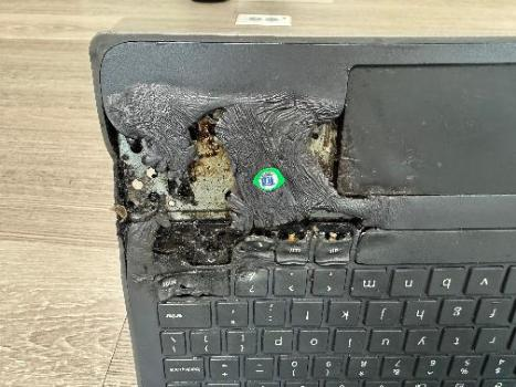 A photo showing the damage a Boulder Valley School District student inflicted on their computer by attempting to short-circuit it or puncture the lithium battery. Image courtesy of Randy Barber, Boulder Valley School District (Courtesy of Randy Barber, Boulder Valley School District)