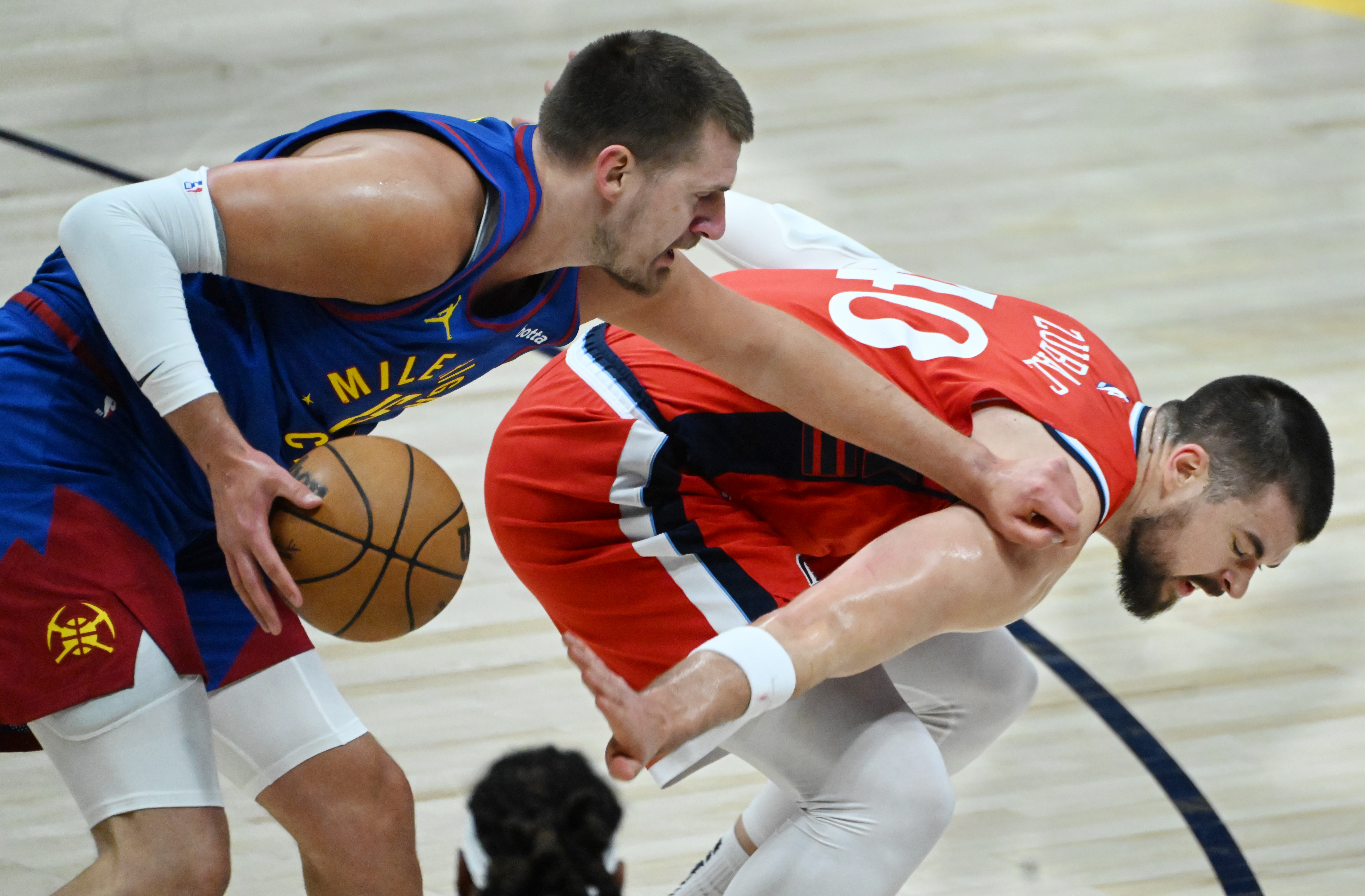 Denver Nuggets center Nikola Jokic (15) fights LA Clippers center Ivica Zubac (40) for the ball during the first quarter of game 7 against the Clippers in the first round of the Western Conference Championship on Saturday, May 3, 2025 at Ball Arena. (Jerilee Bennett,The Gazette)