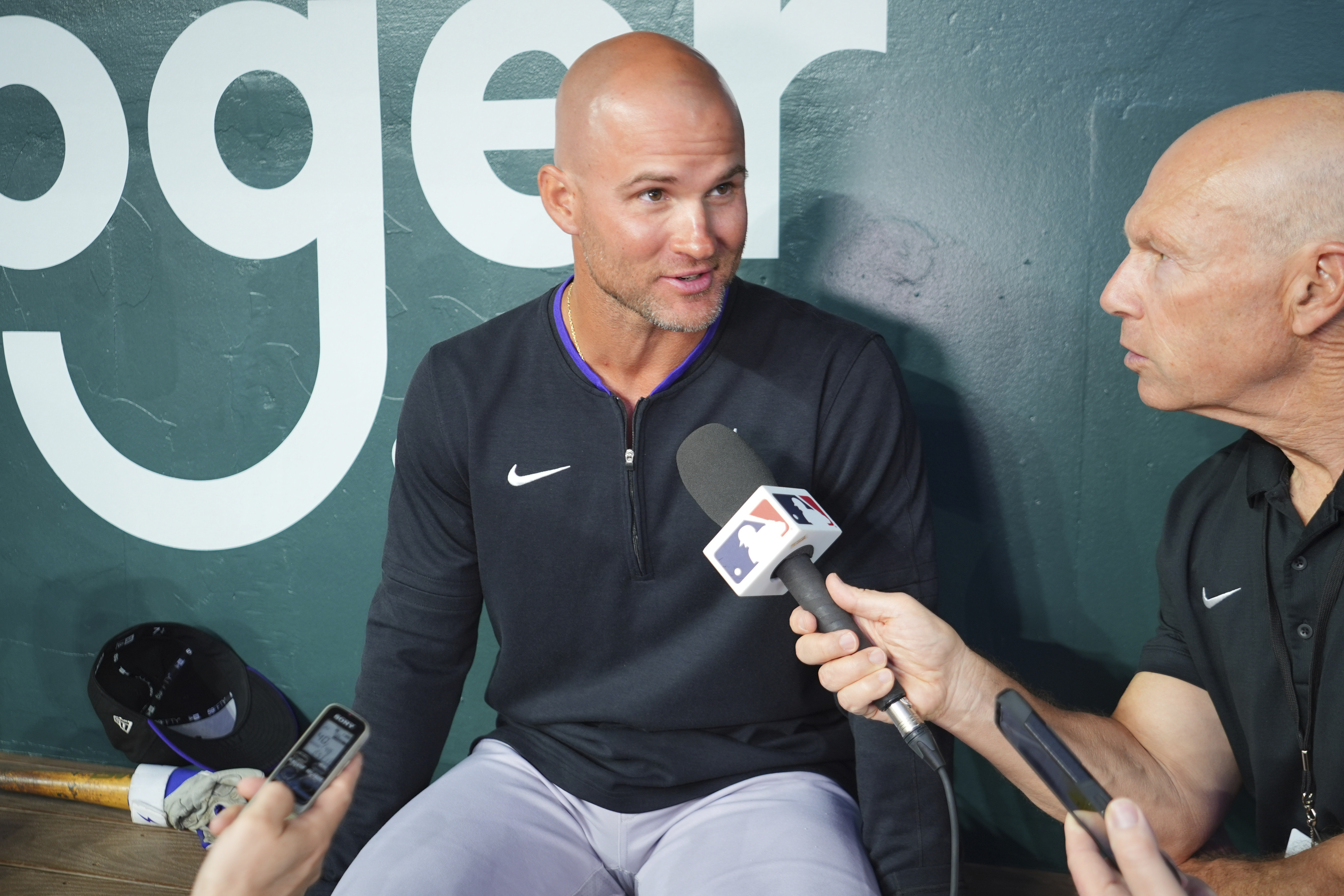 Colorado Rockies interim manager Warren Schaeffer, left, speaks in the dugout before a baseball game against the Texas Rangers, Monday, May 12, 2025, in Arlington, Texas. (AP Photo/LM Otero) (LM Otero)